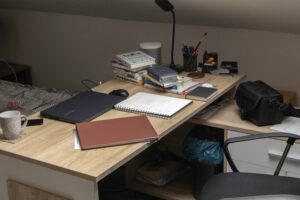 cozy guest bedroom with a compact work desk