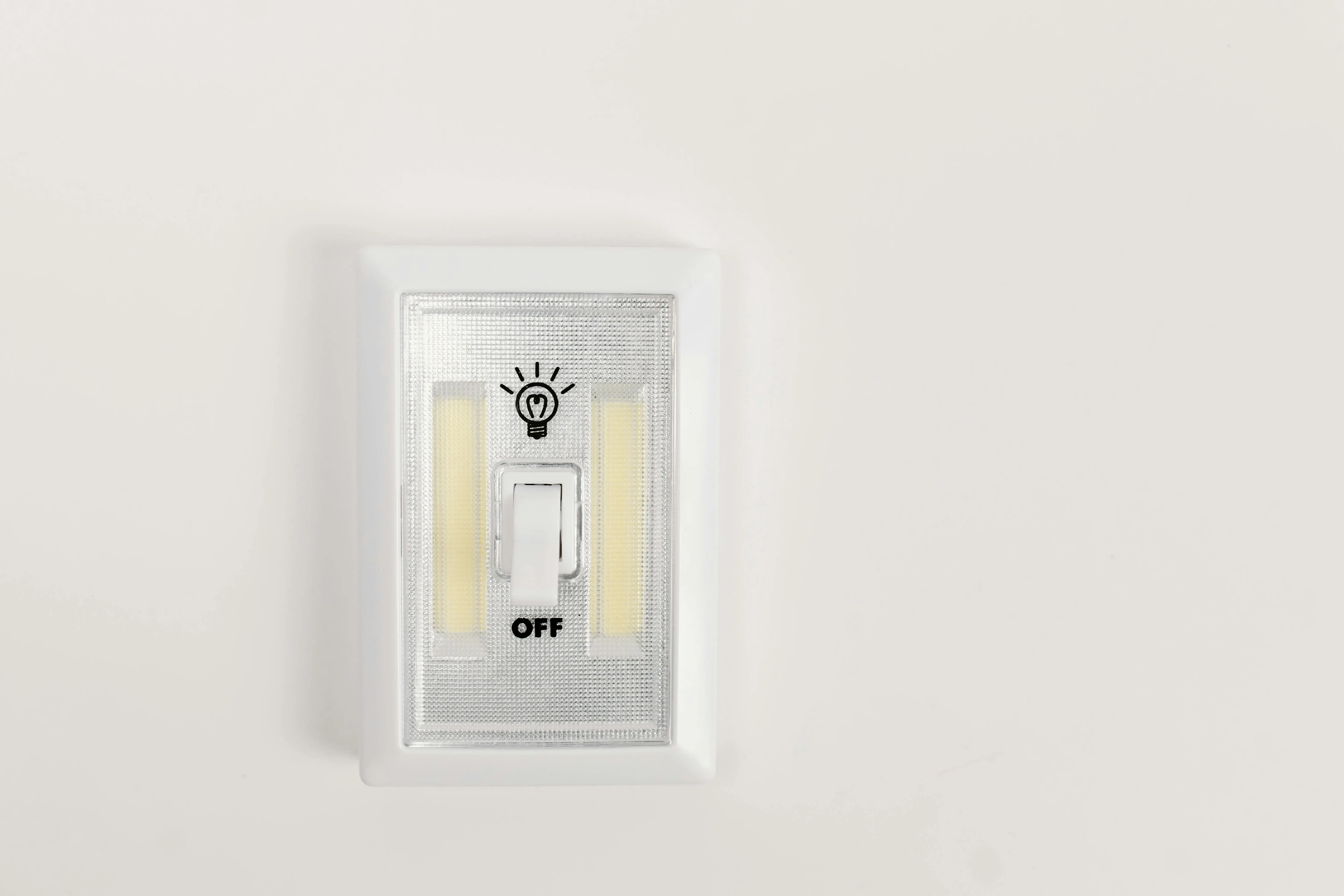 light switch wiring diagram Minimalist light switch turned off on a plain white wall, offering ample copy space.