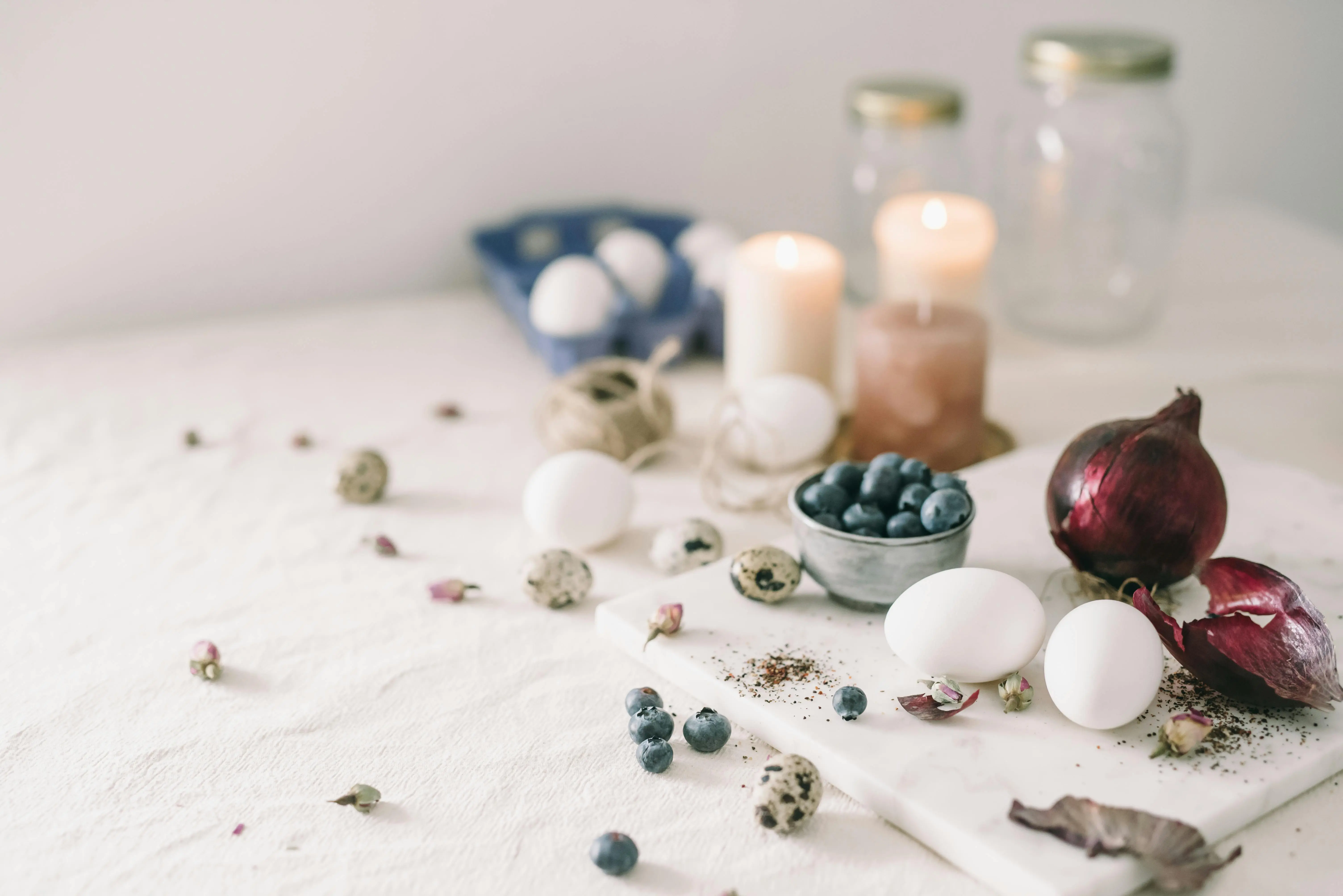 homemade laundry detergent A serene arrangement with eggs, blueberries, and candles captures the essence of spring indoors.