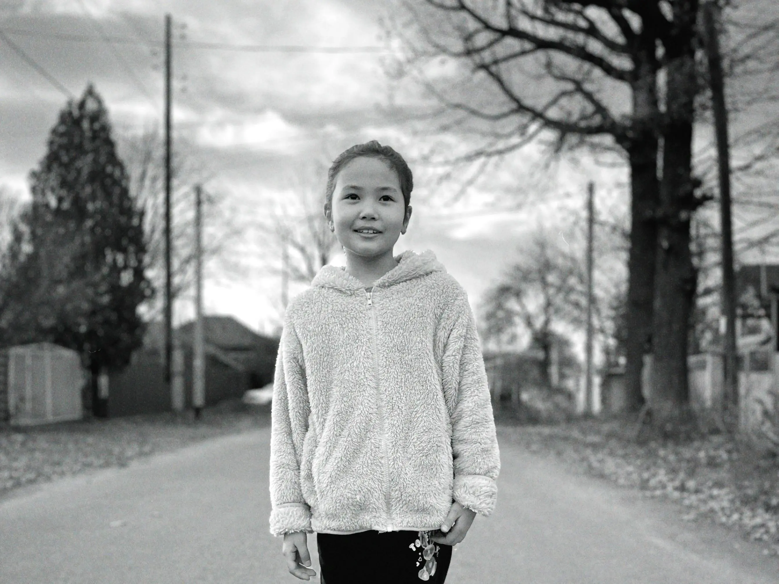 light switch wiring diagram A smiling child posing casually on a quiet street in Talgar, Kazakhstan.