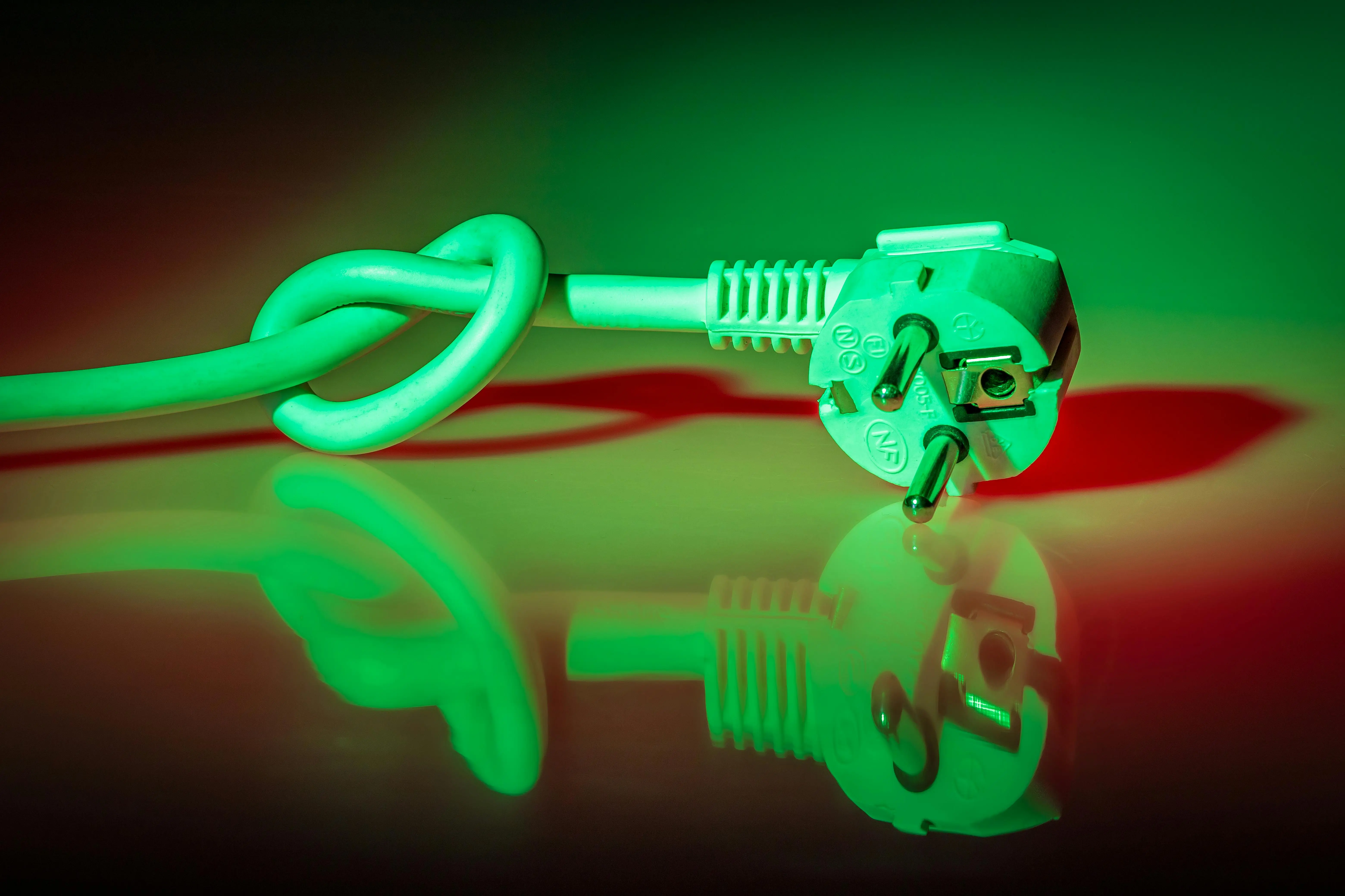 how to get rid of static on clothes A knotted electrical plug showing reflection with vibrant lighting effects.