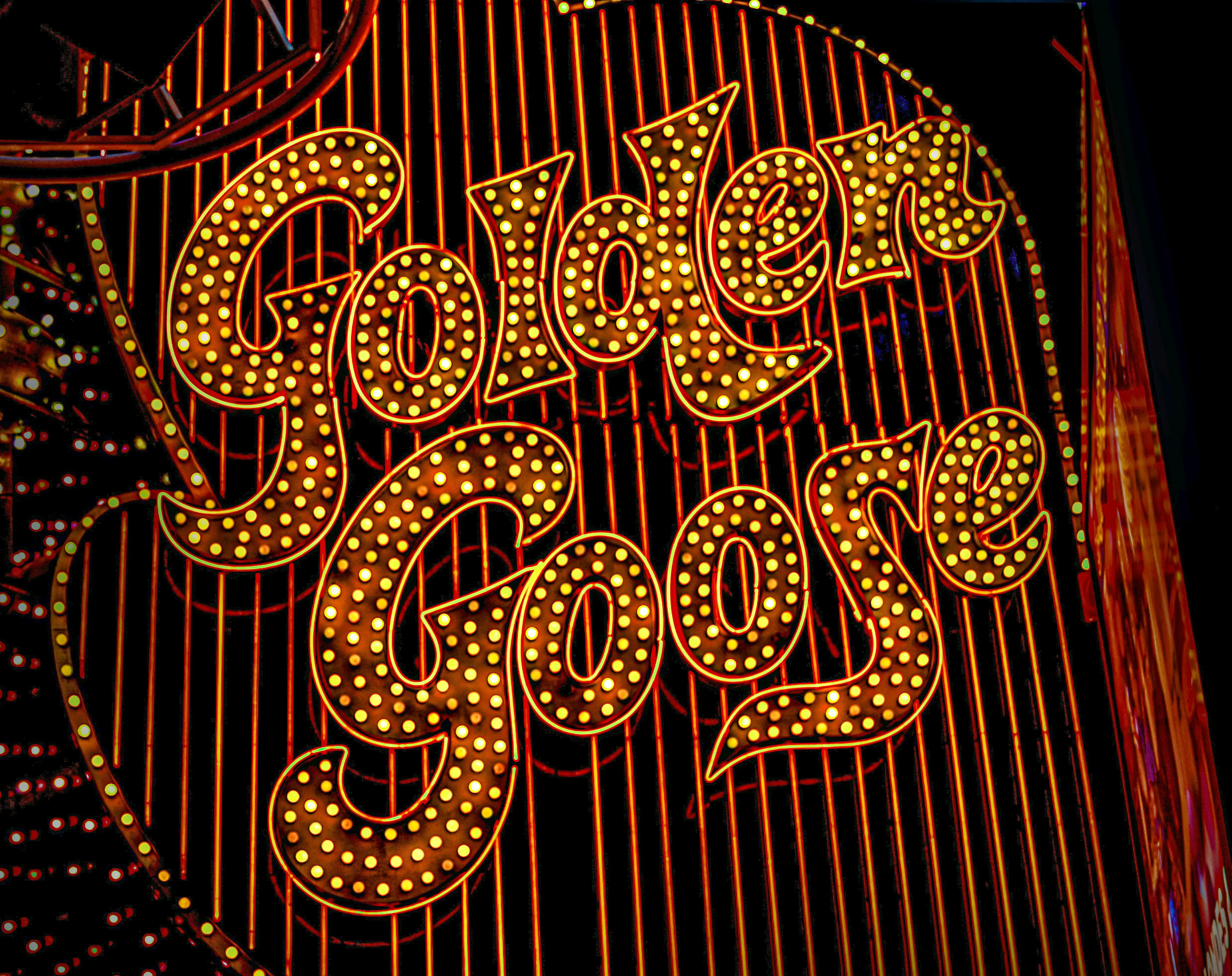 outdoor led strip lights Close-up of the Golden Goose casino sign illuminated at night in Las Vegas.