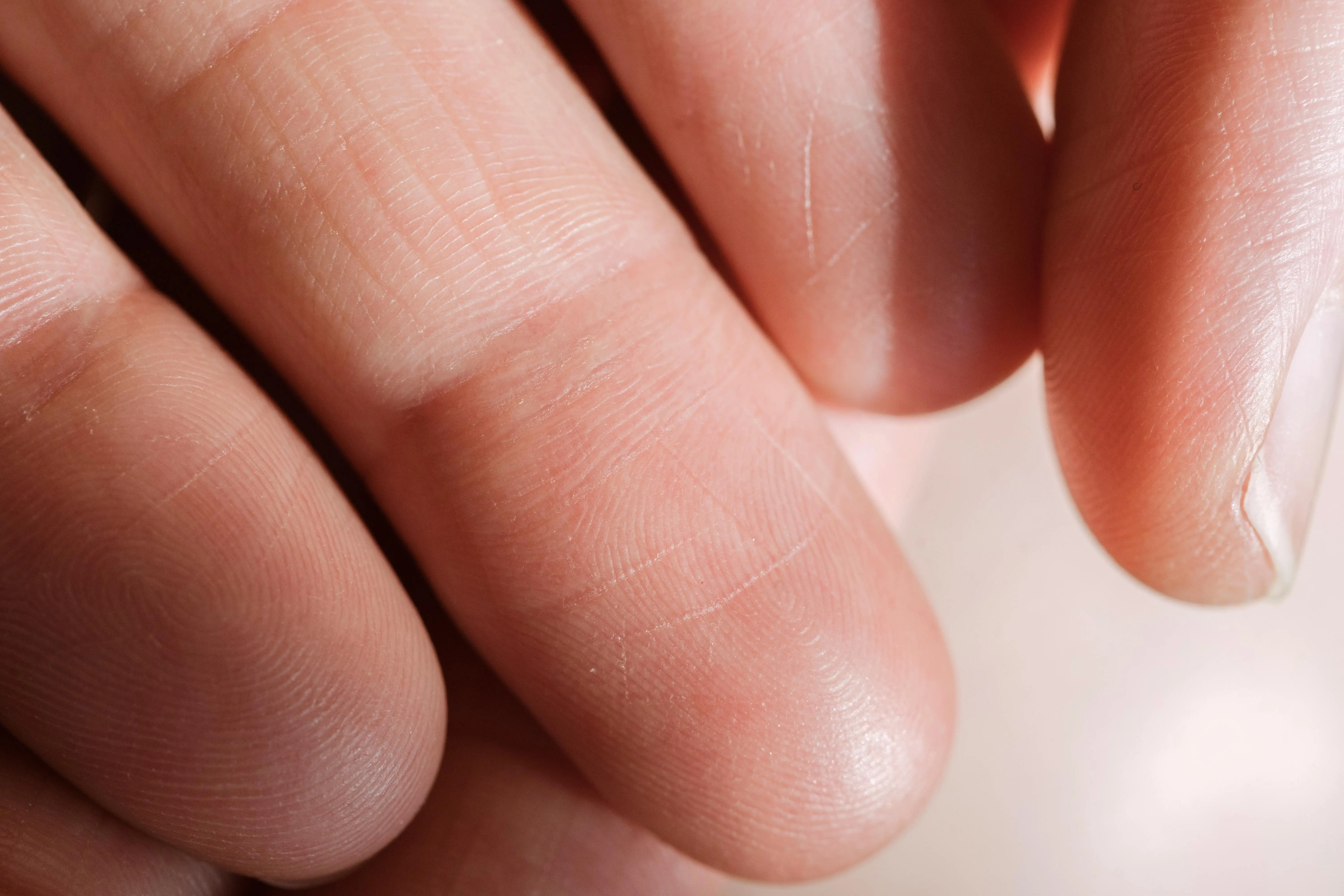 spring crafts Detailed close-up of human fingers showing skin texture and fingerprints.