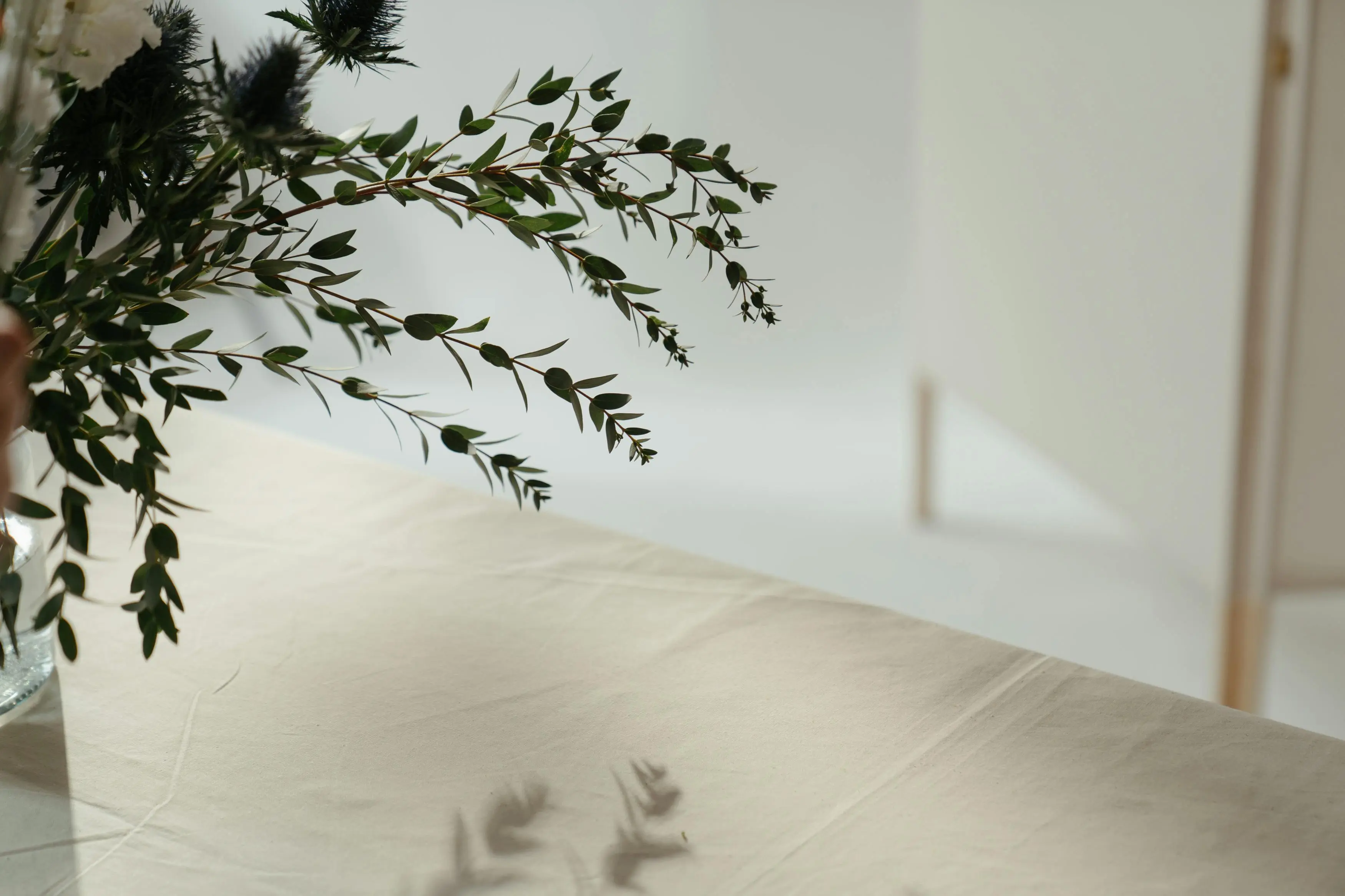 flax lily Beautiful minimalist floral arrangement on a linen tablecloth, perfect for decor inspiration.