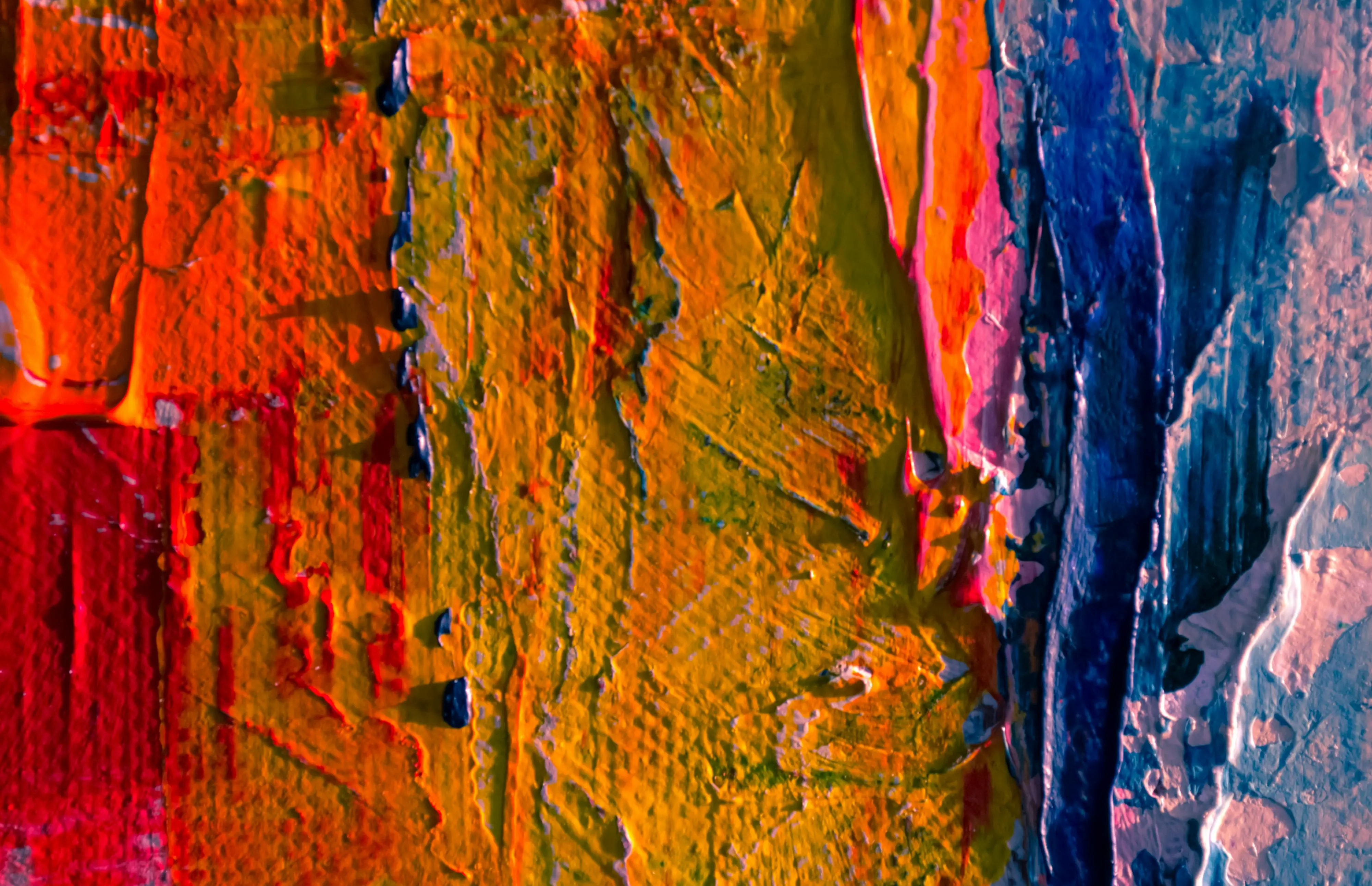 what to paint Close-up of vibrant abstract acrylic paint textures with vivid colors.