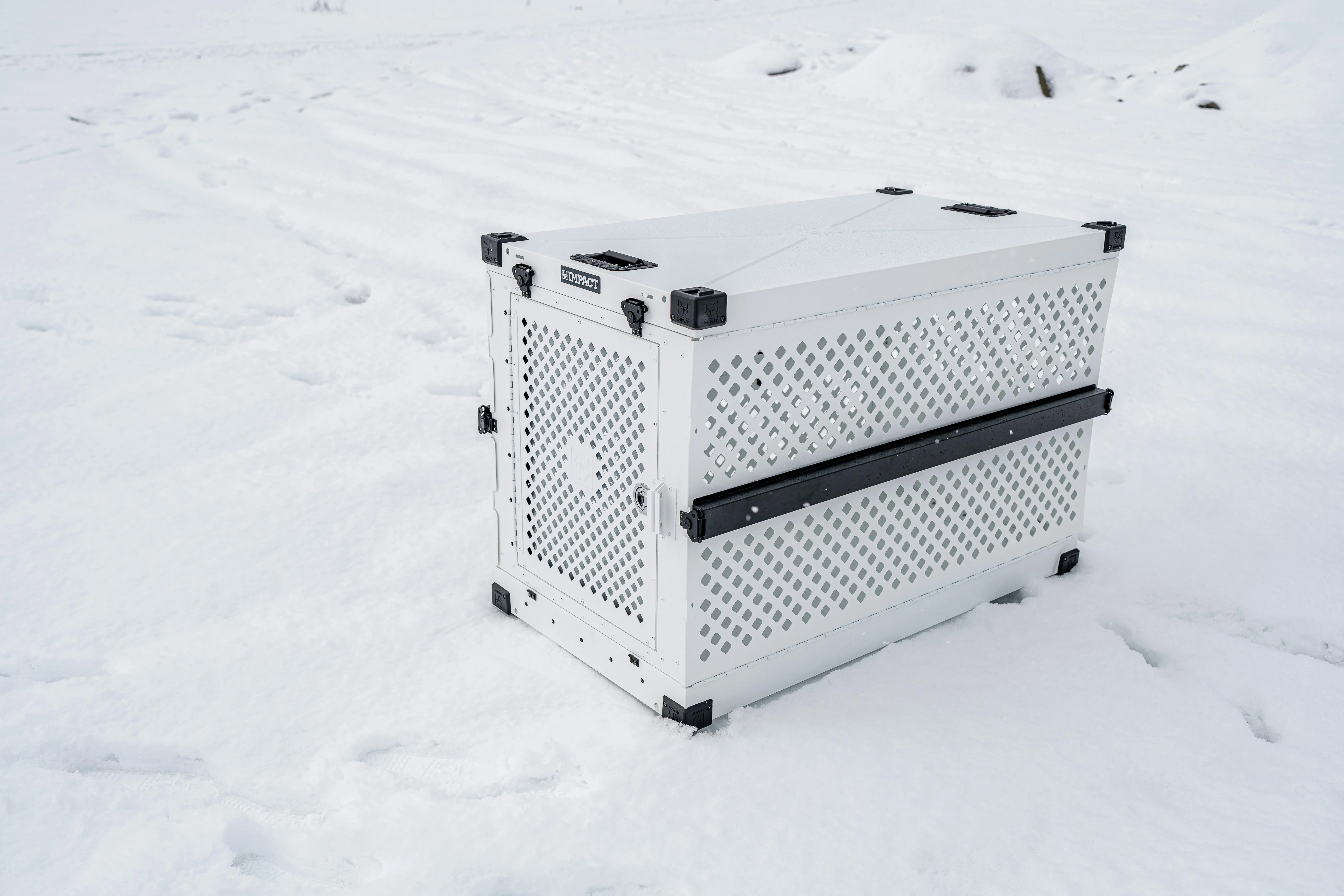 rat poison box Sturdy pet crate designed for cold conditions, shown in a snowy outdoor setting.