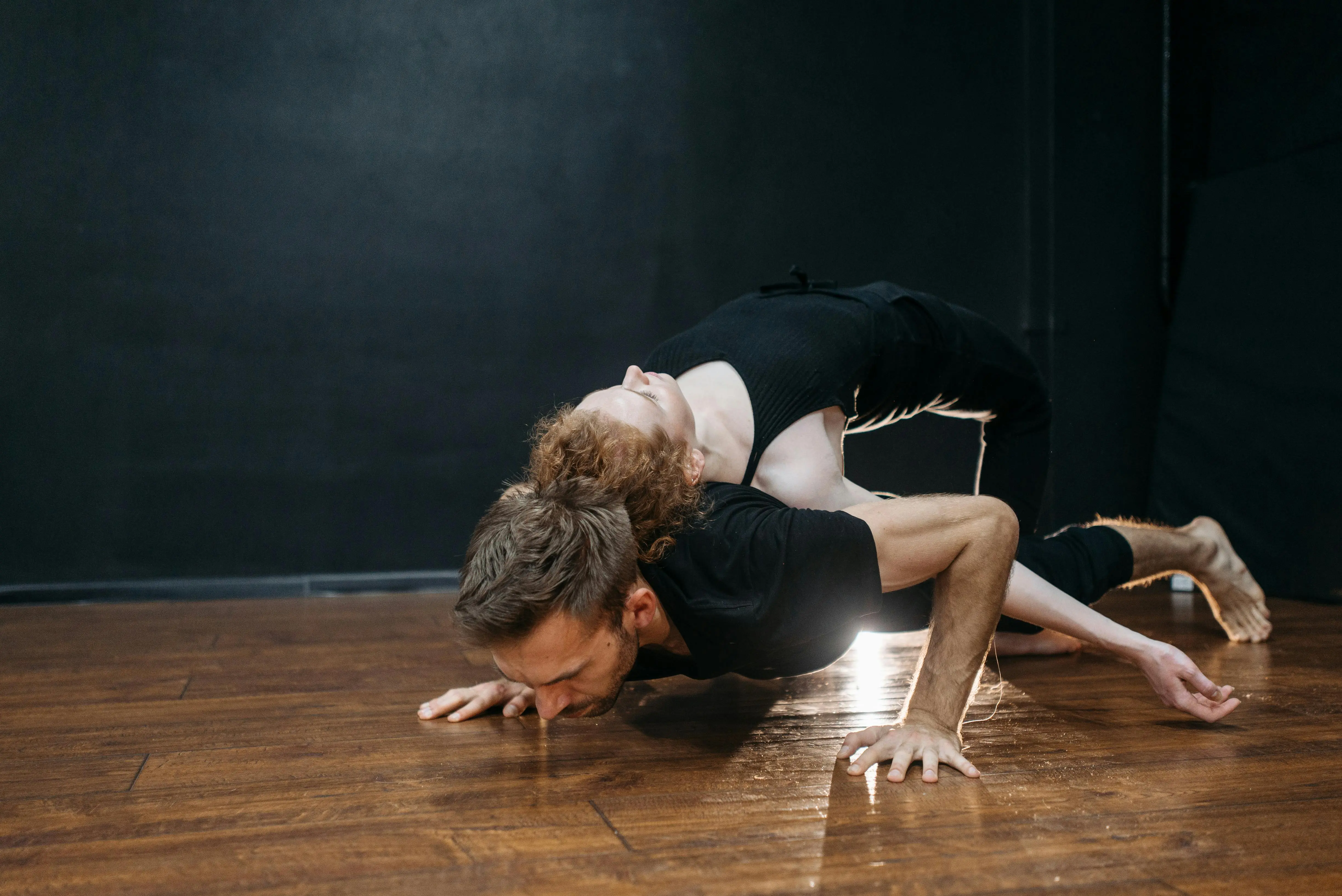 diy dance floor Contemporary dancers express emotion and flexibility in a captivating indoor performance.