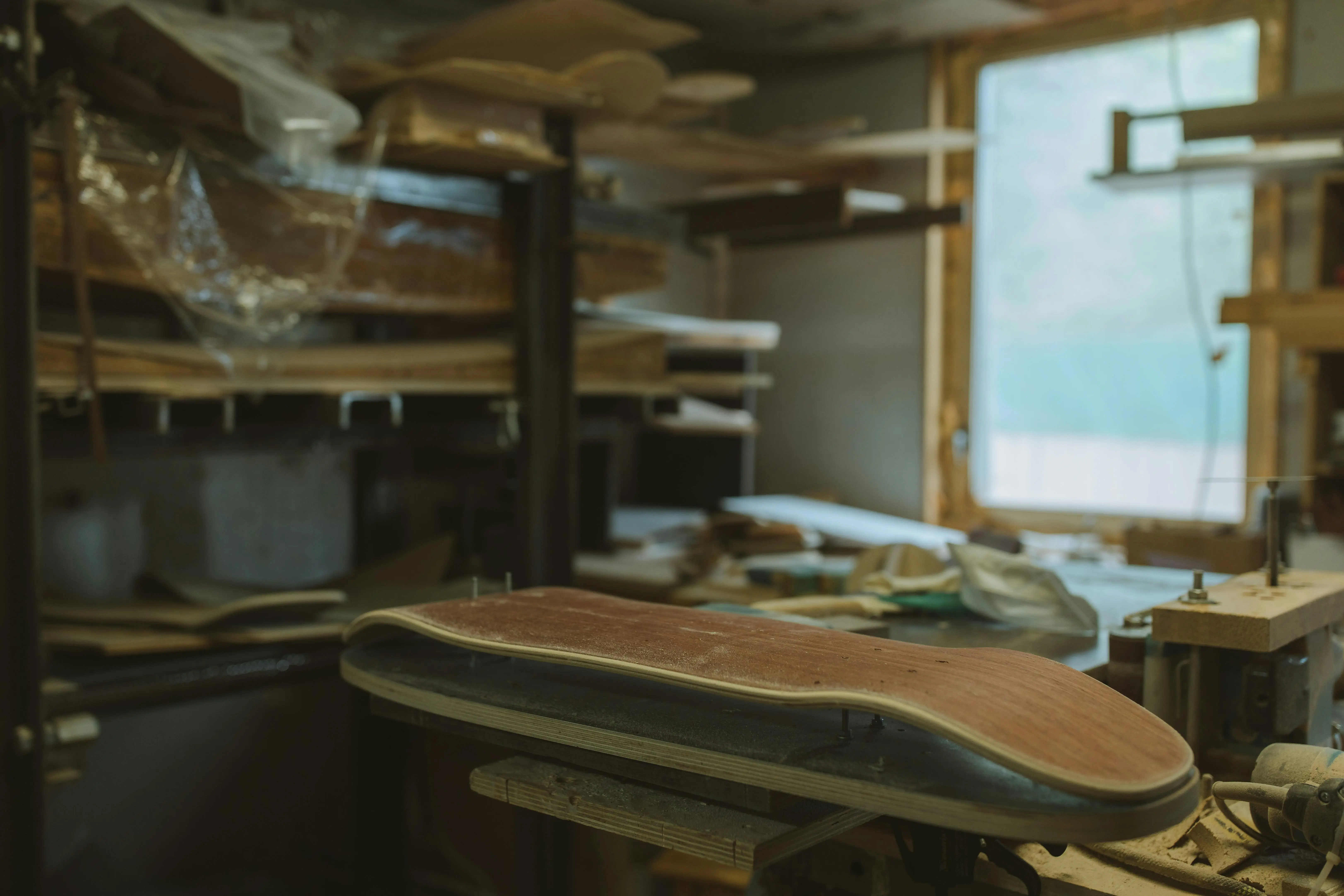 12x20 deck plans A glimpse into the detailed crafting process in a wooden skateboard workshop.