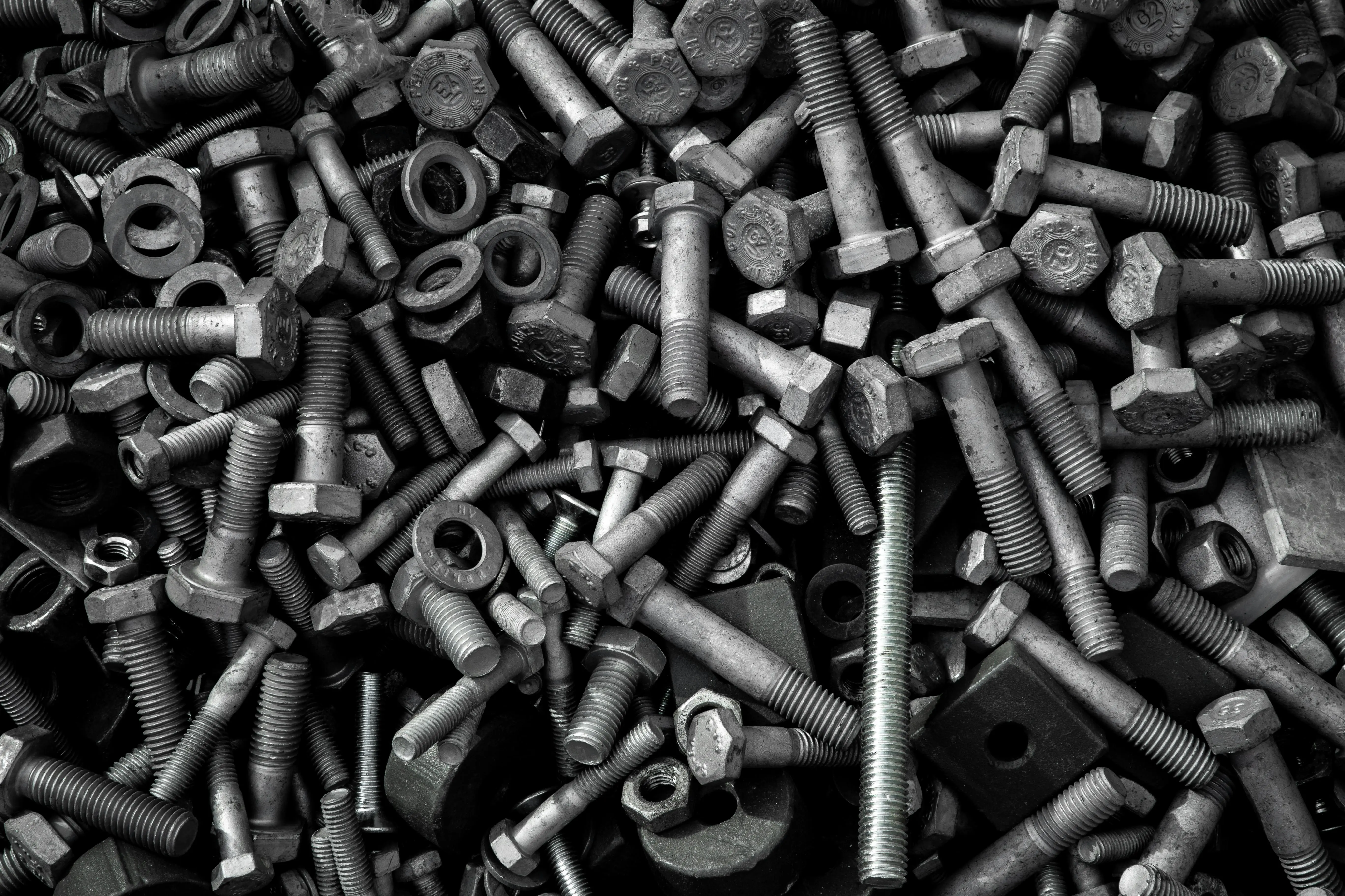 drywall screw dimensions Detailed image of assorted industrial bolts and screws for recycling or mechanics.