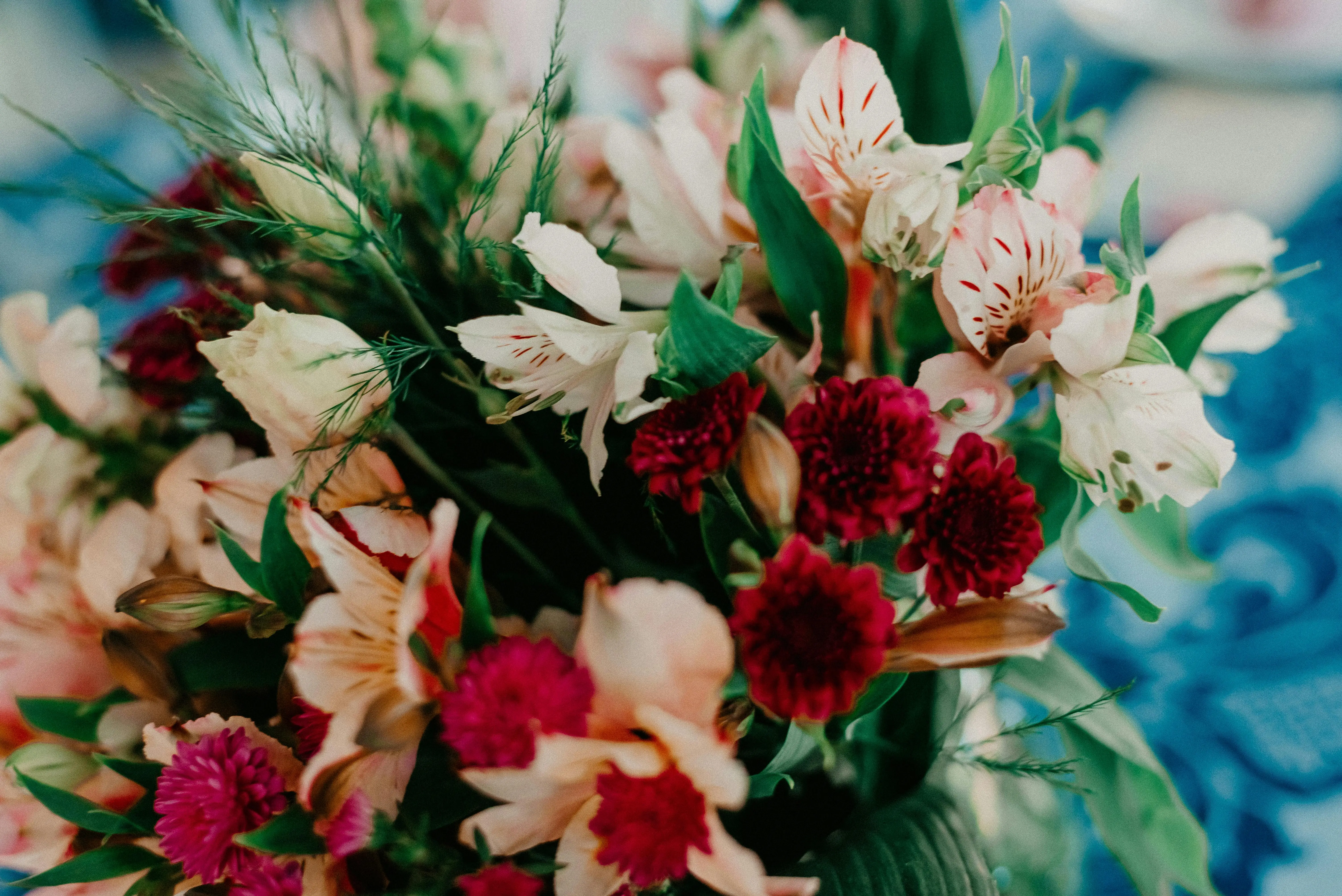 large bouquet Close-up of a lush, vibrant floral bouquet featuring red and white flowers, perfect for weddings and events.