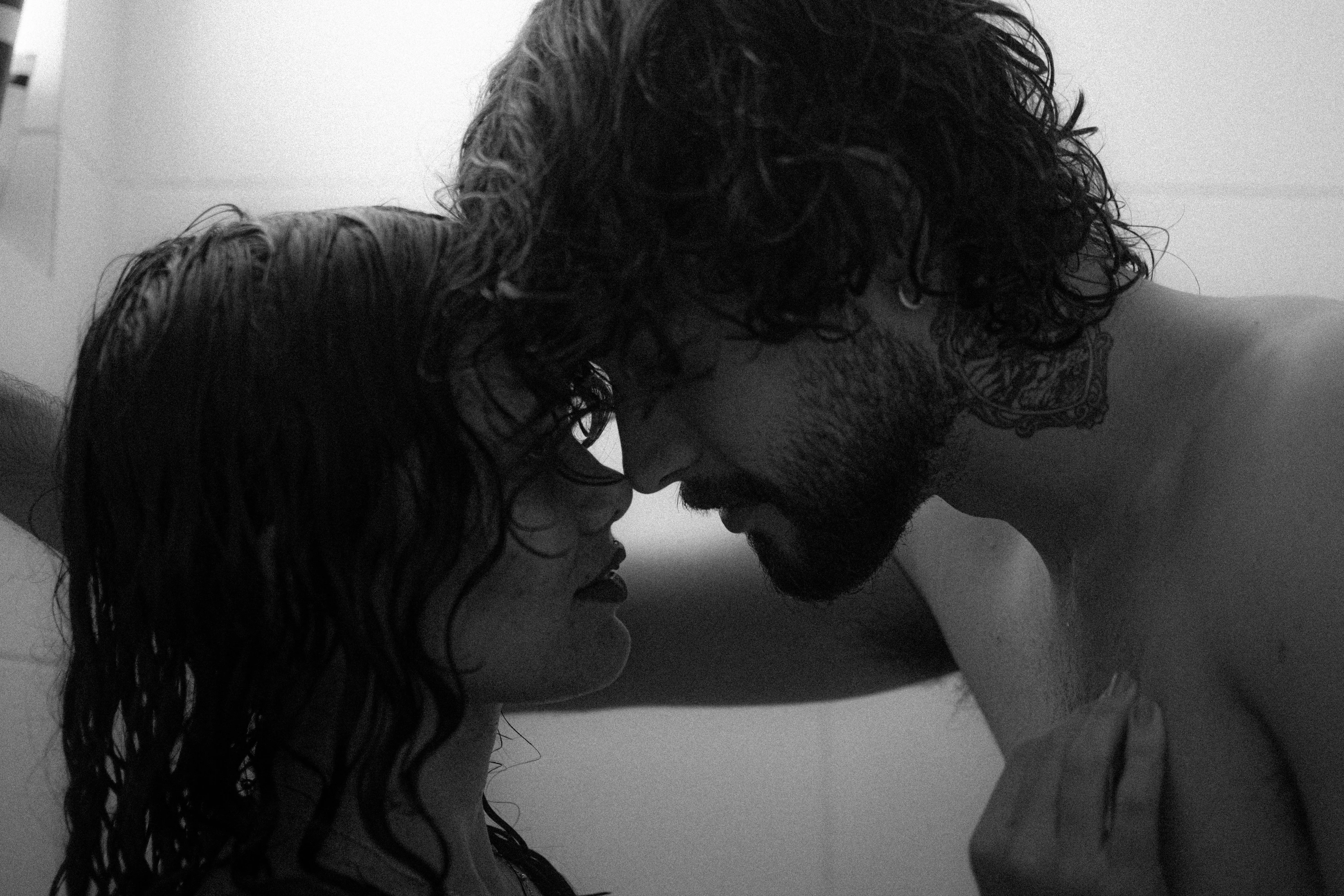 ideas for replacing a garden tub Romantic black and white photo of a young couple sharing an intimate moment in the shower.