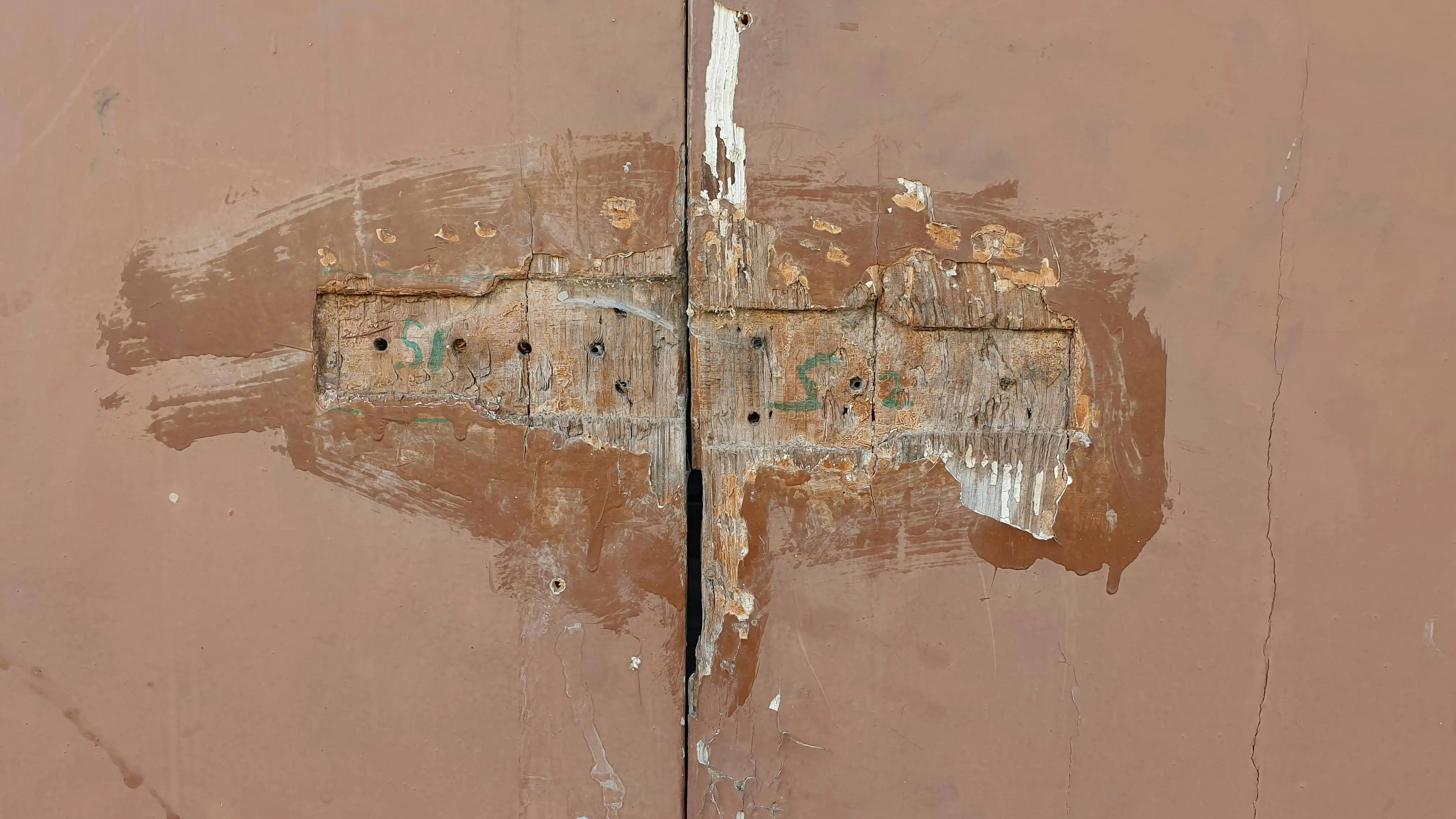 suspended ceiling alternatives Detailed close-up of a weathered wooden window shutter with peeling paint and visible texture.