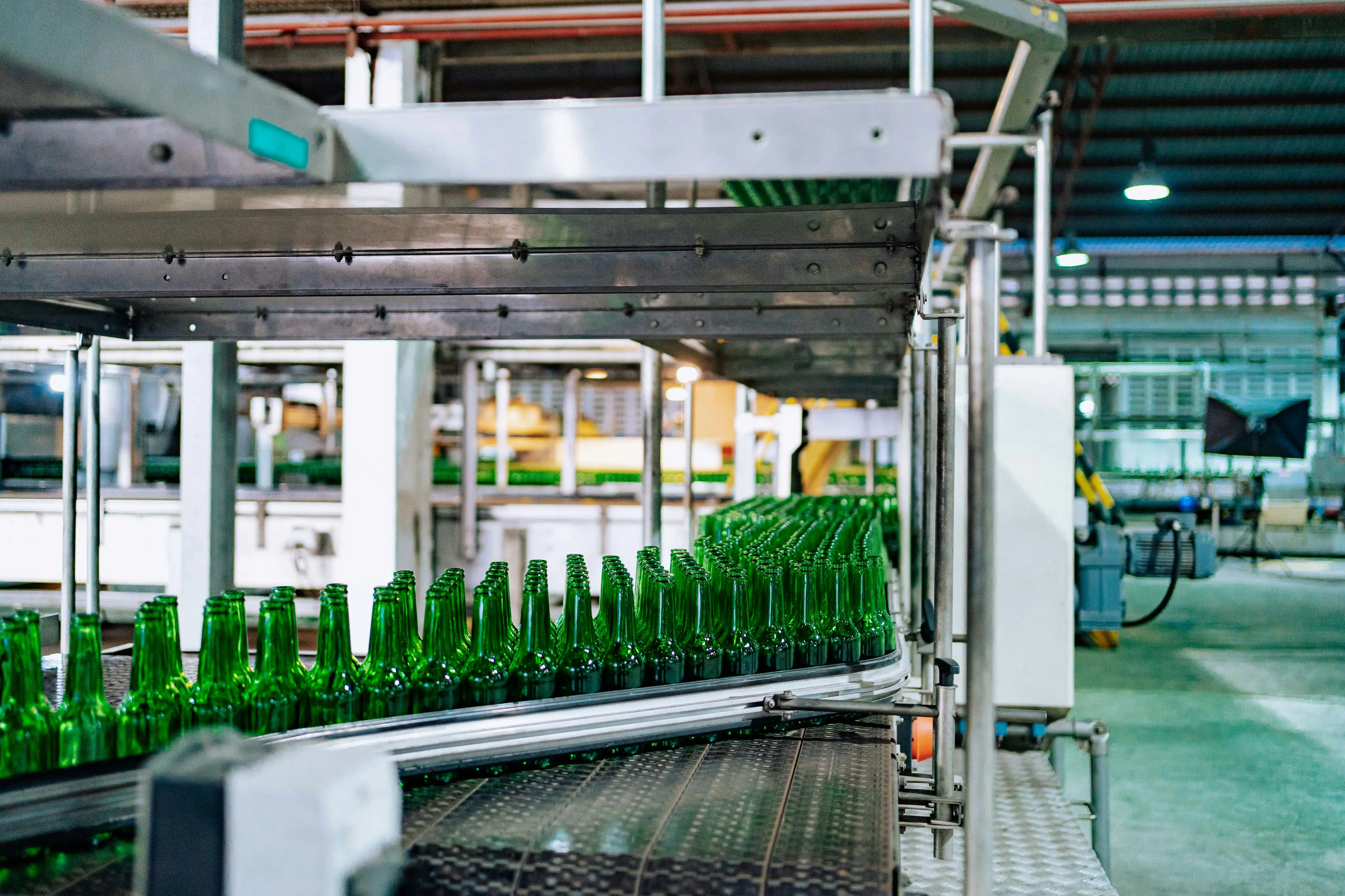 commercial clothes dryer Streamlined glass bottle manufacturing process in factory setting, showcasing assembly line automation.