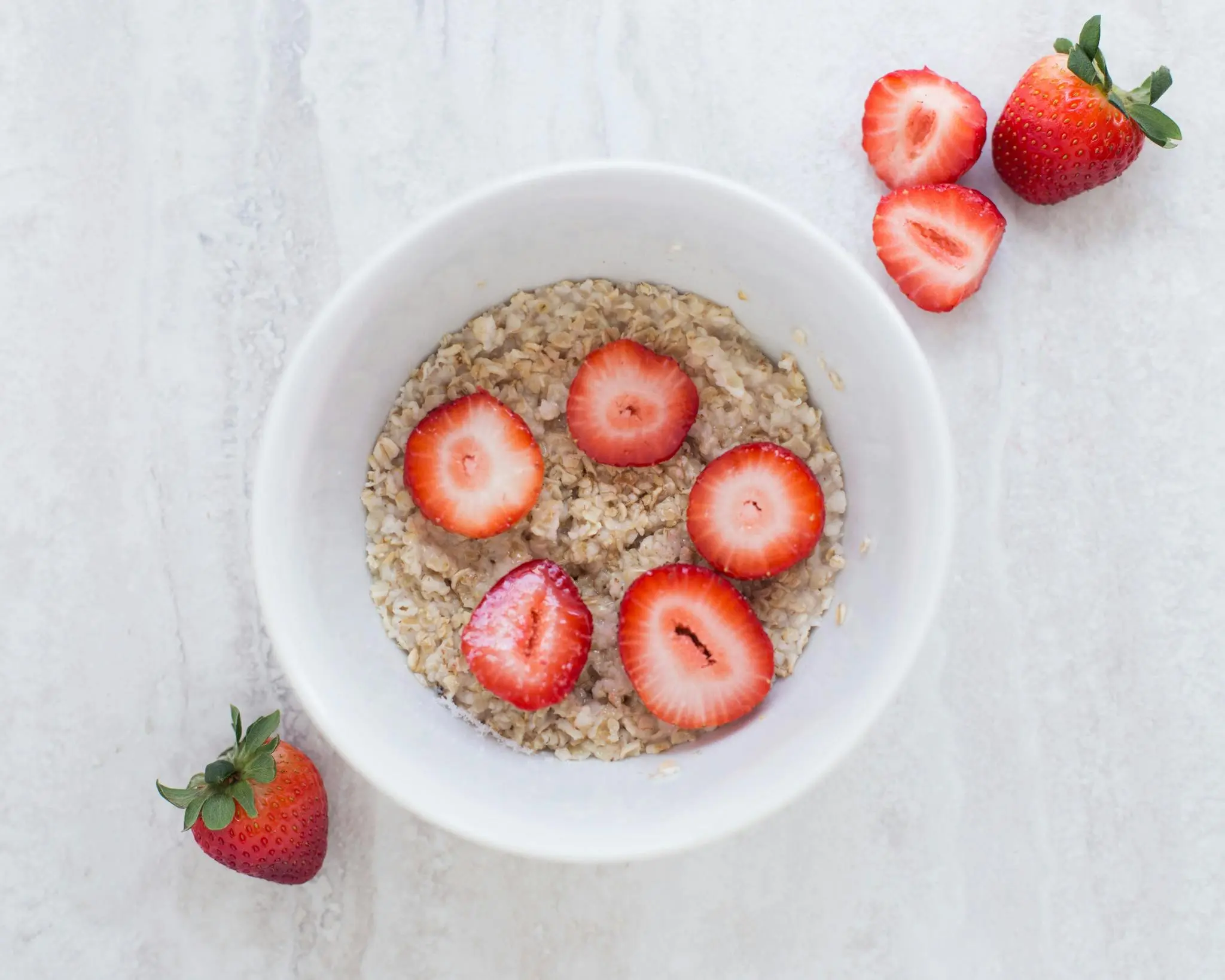 flat roof coating A fresh and nutritious breakfast bowl featuring oats topped with sliced strawberries.