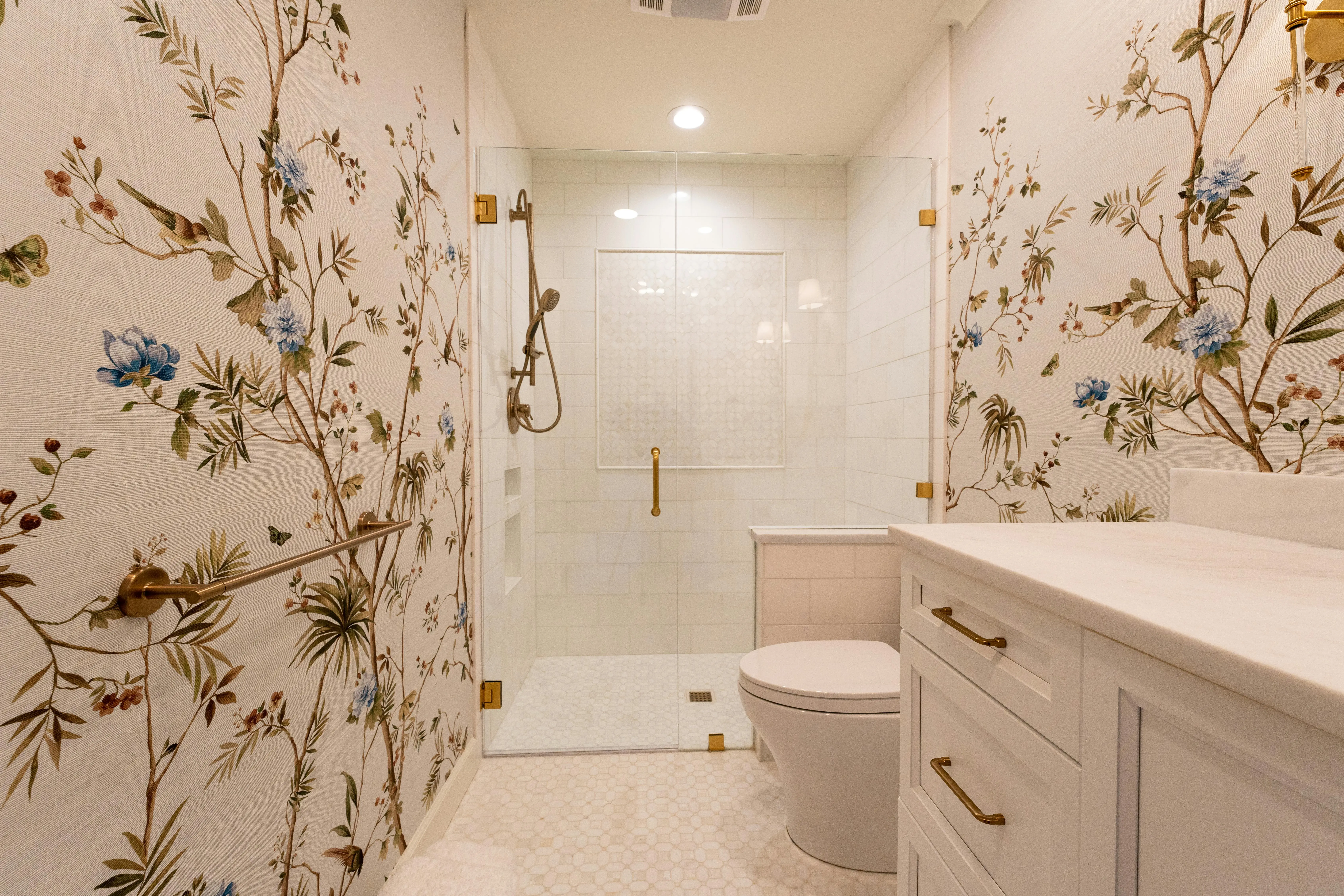 floral tile backsplash Luxurious bathroom with floral wallpaper and modern fixtures, showcasing elegant interior design.