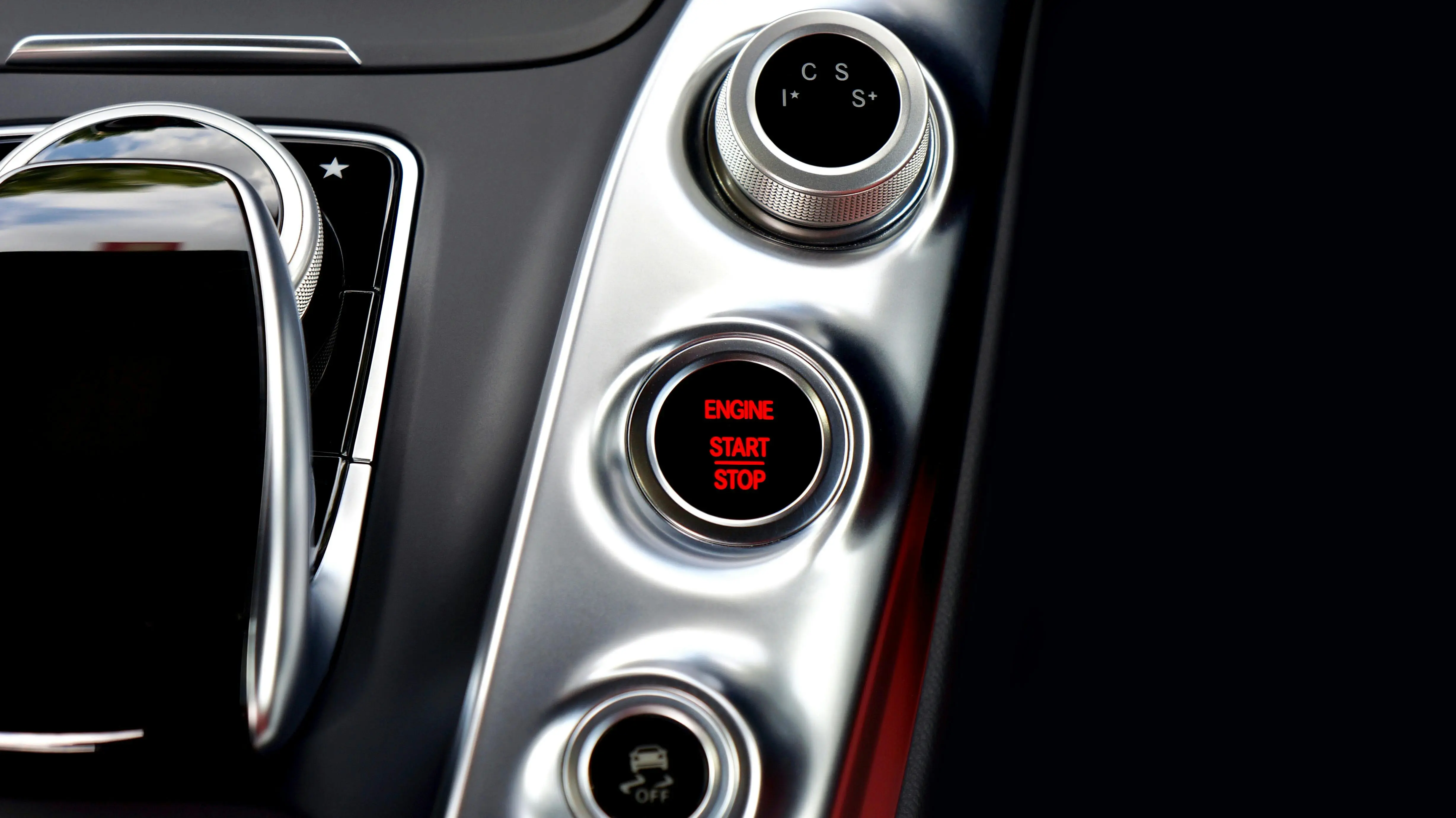 flowers that start with v Close-up of a modern Mercedes car interior featuring a start-stop button and control panel.