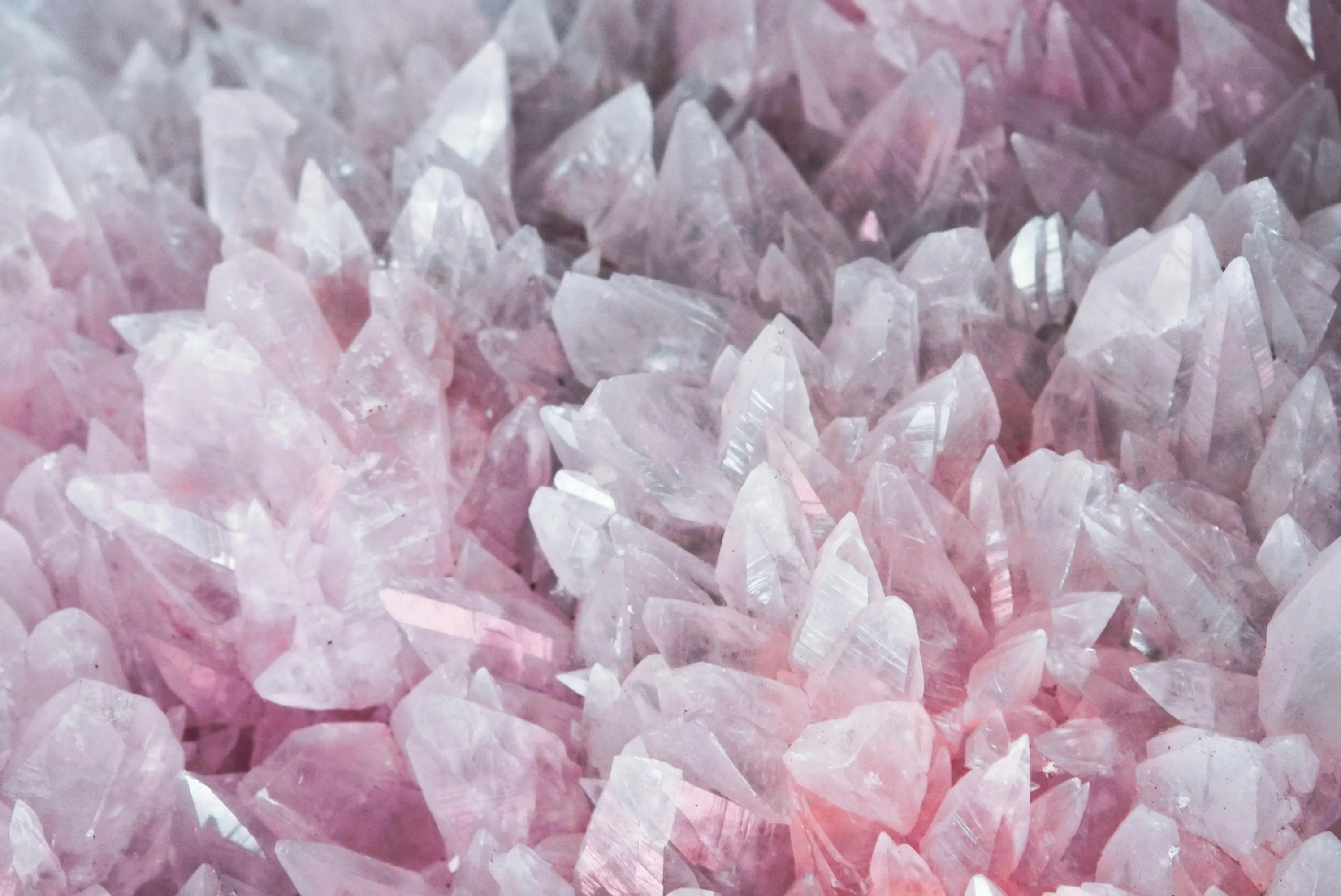 green quartz countertops A detailed close-up of rose quartz crystals showcasing their pink hues and translucent nature.