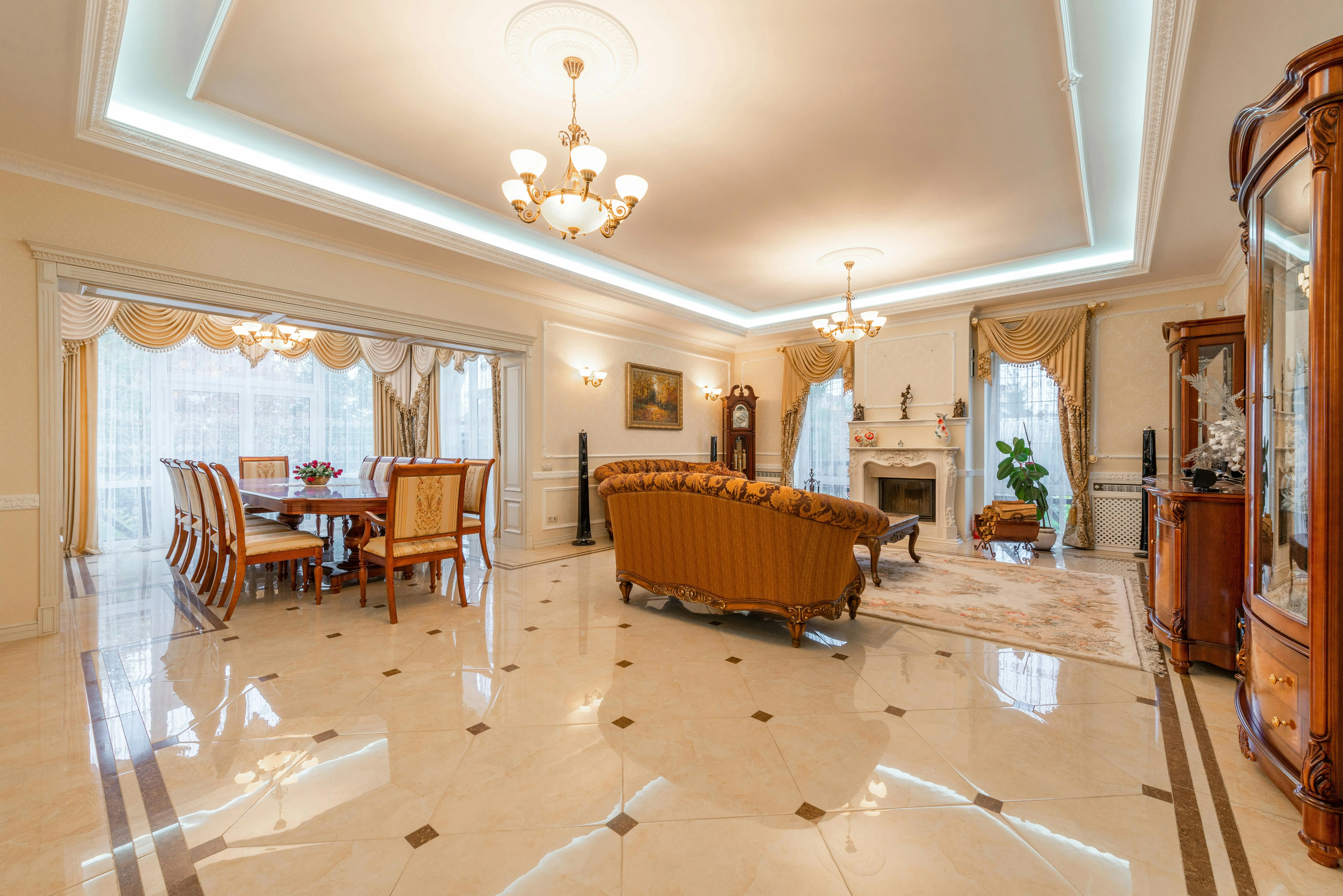exclusive opulent interior designs Spacious and elegant interior design featuring a luxe living room and dining area.