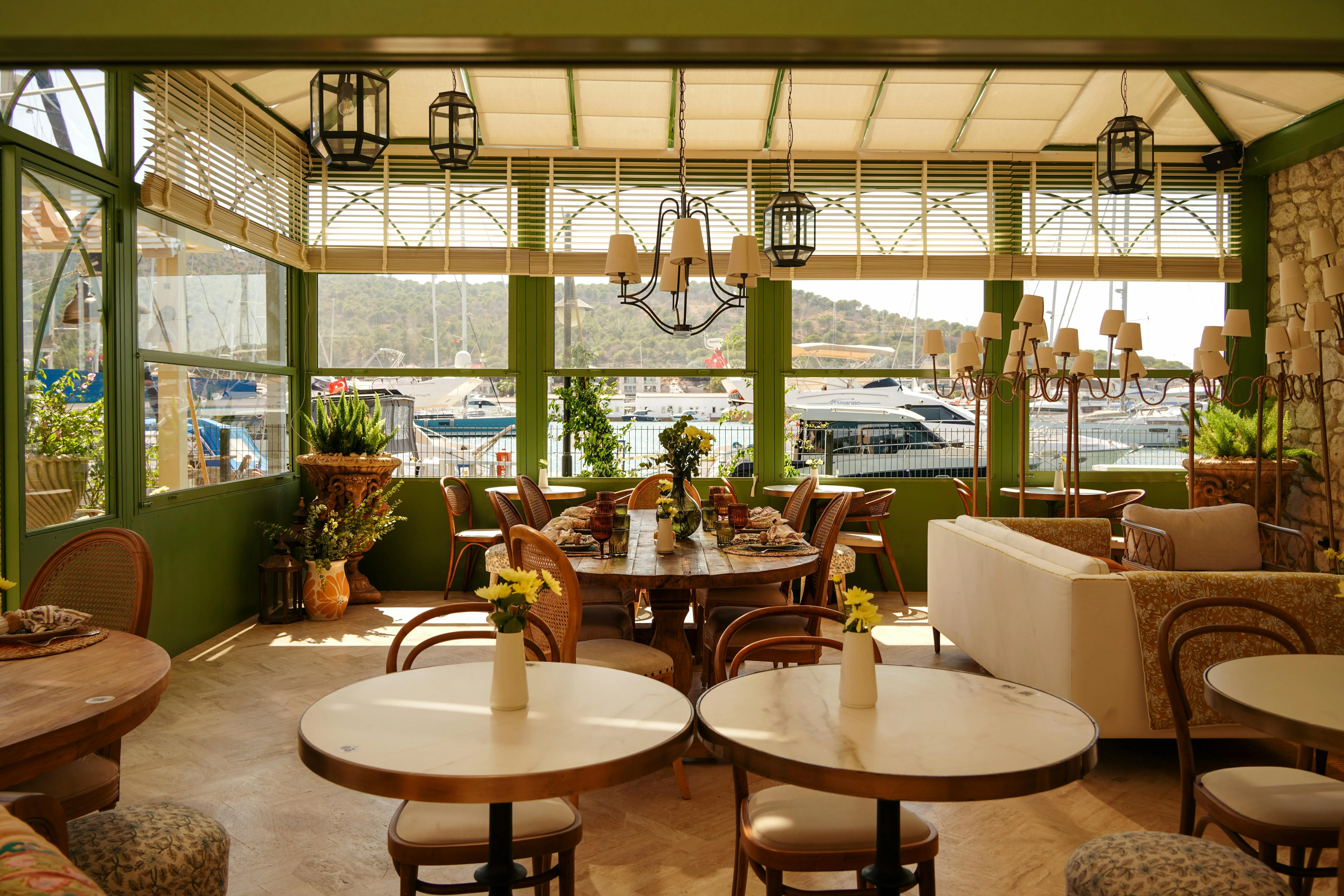 coastal chandelier Bright indoor restaurant with elegant decor and marina view. Perfect for dining by the sea.