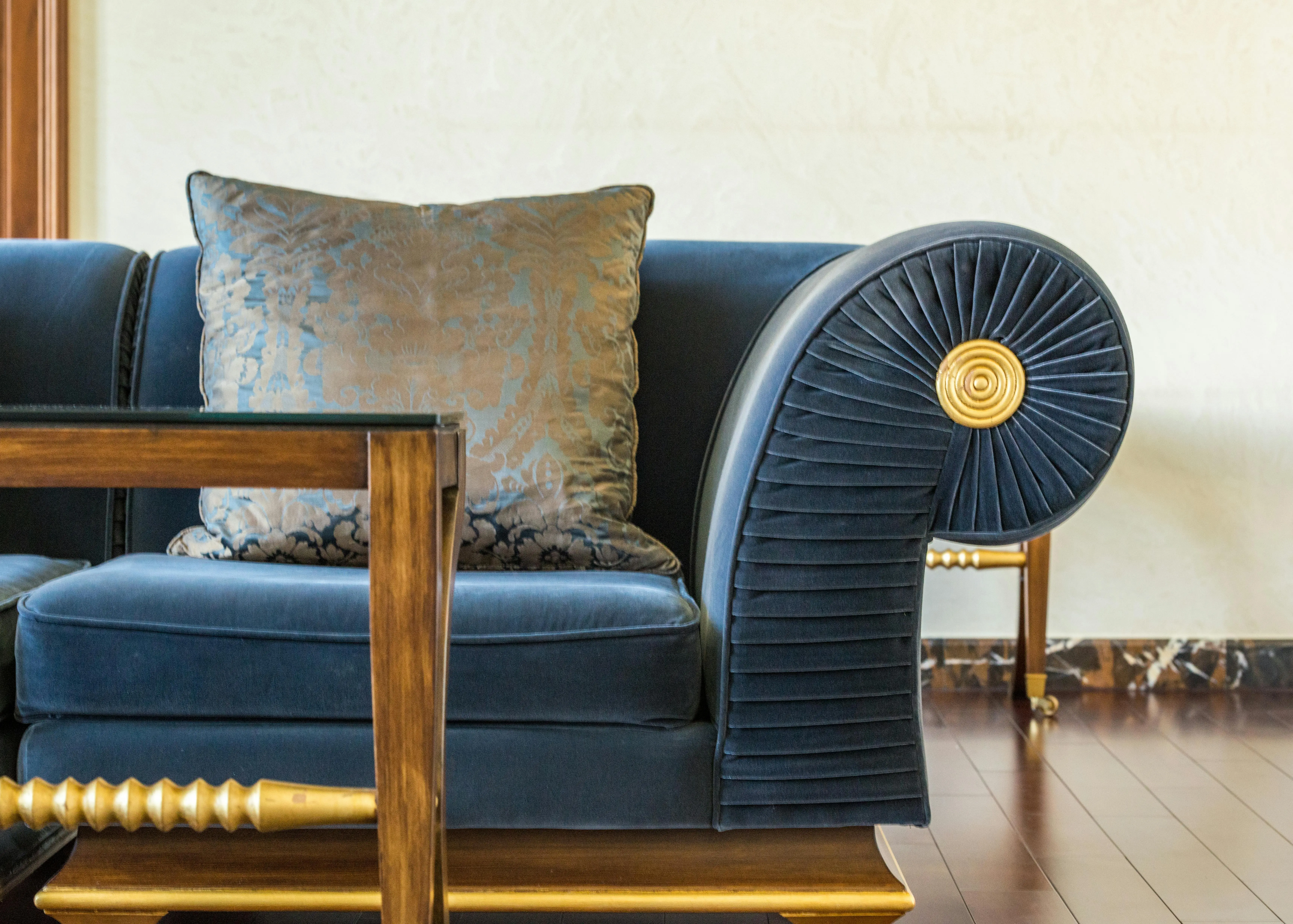 navy throw pillows Interior of lounge with cozy sofa decorated with pillow with pattern in daylight
