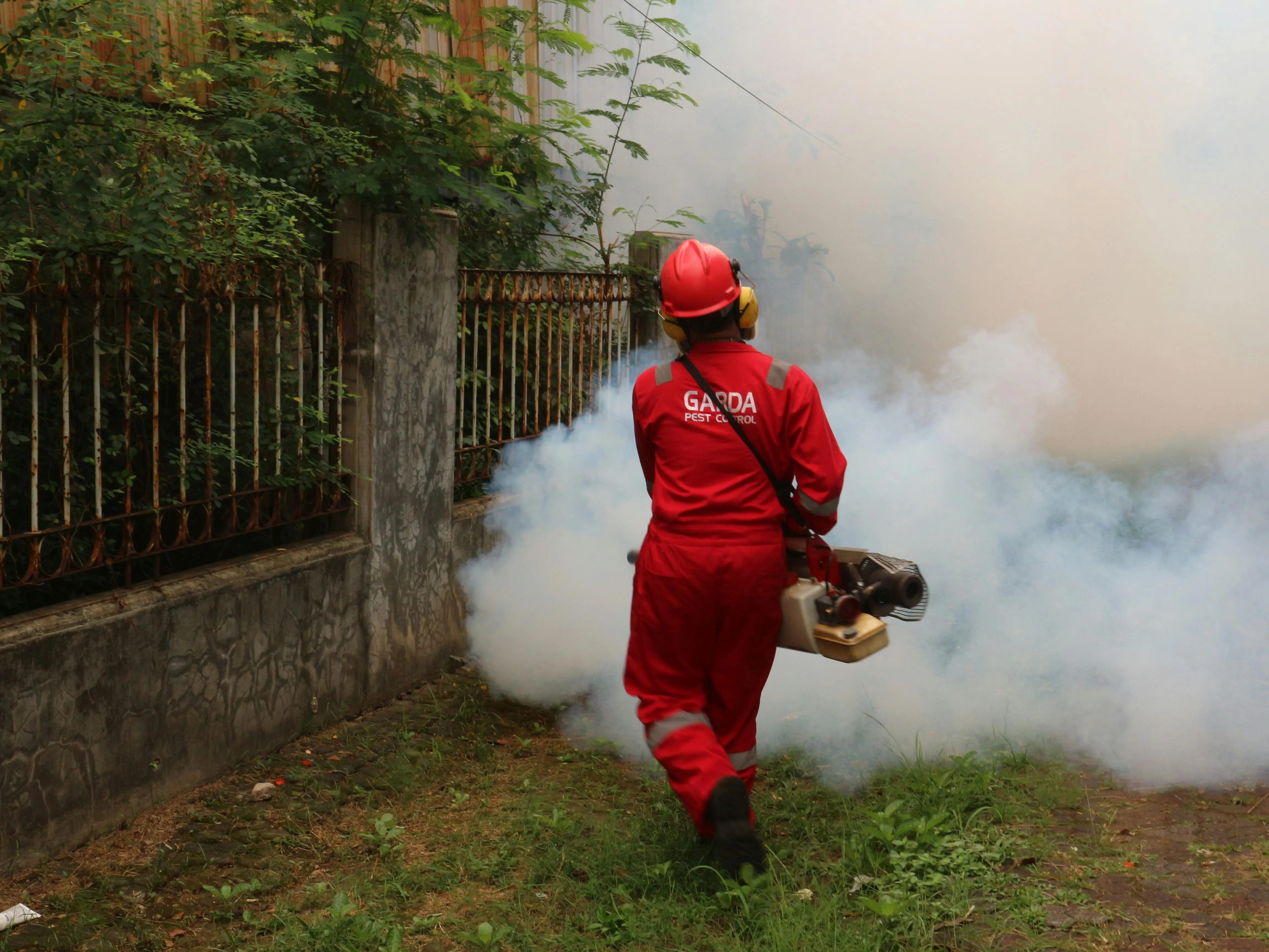 farnam just one bite ii rat A pest control worker fogging in an outdoor space with smoke to eliminate pests.