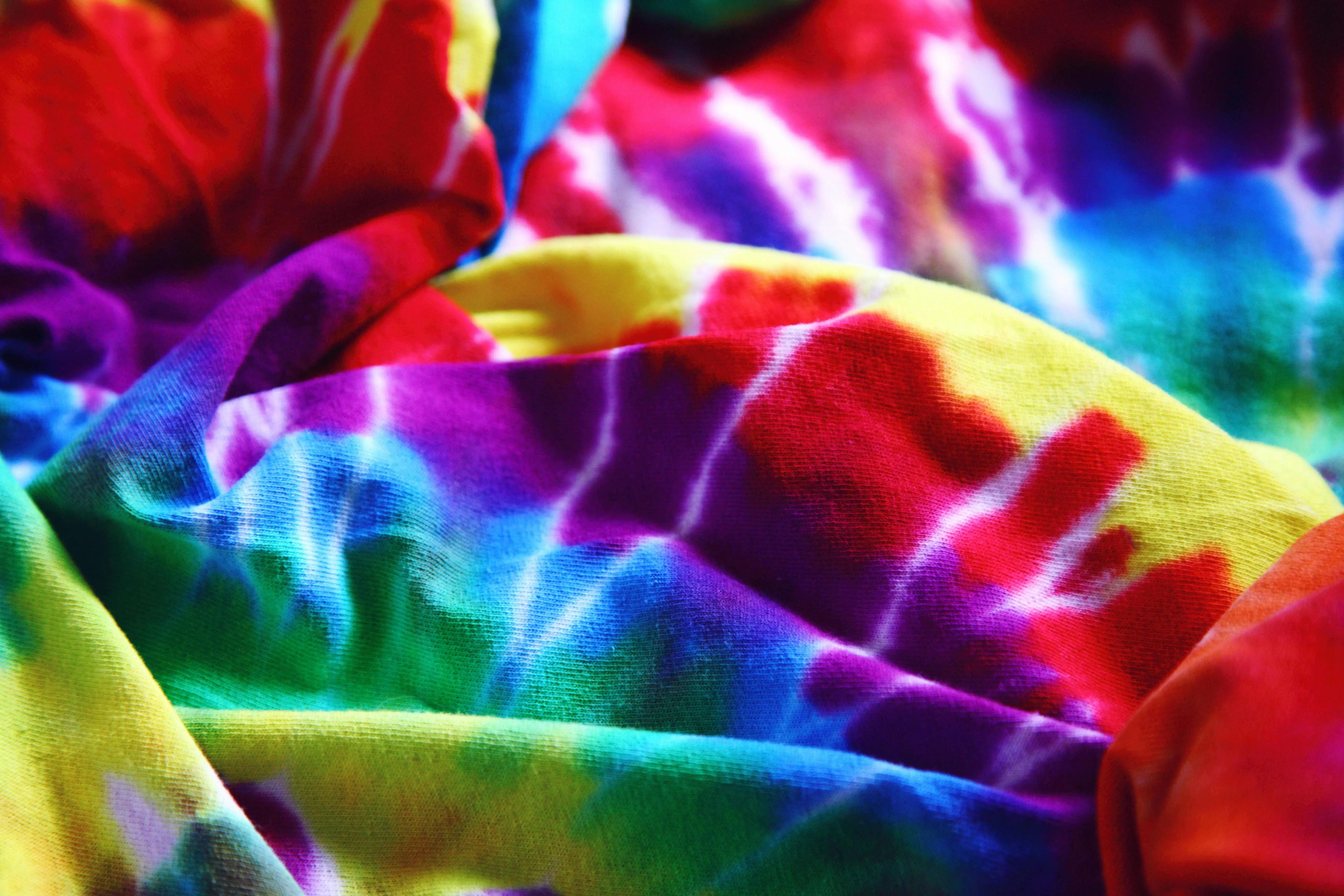 tie dye shirts for men Bright and colorful tie-dye fabric showcasing a rainbow spectrum. Perfect for designs and backgrounds.