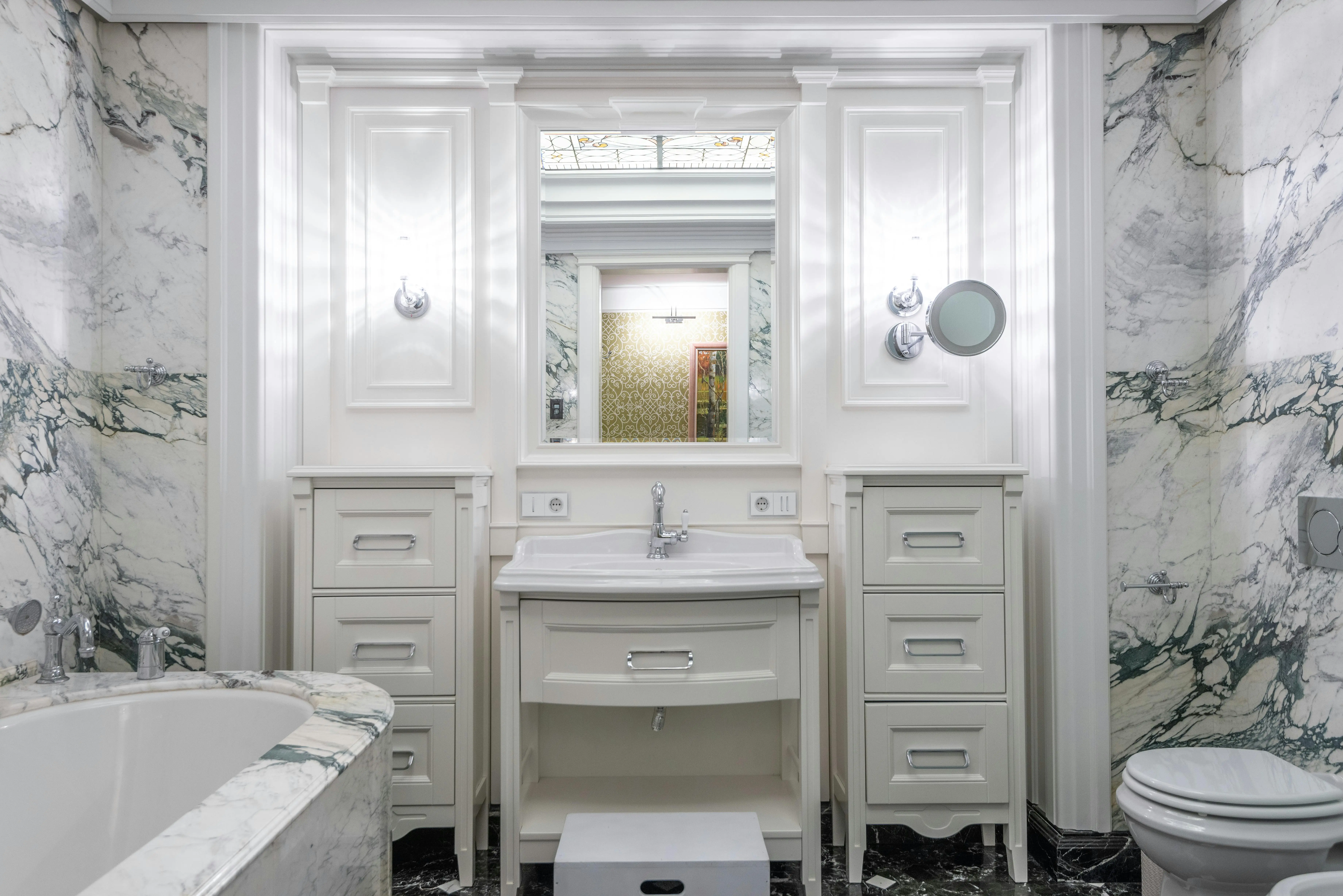 vanity drawer organizer Elegant bathroom design featuring marble walls and modern fixtures.