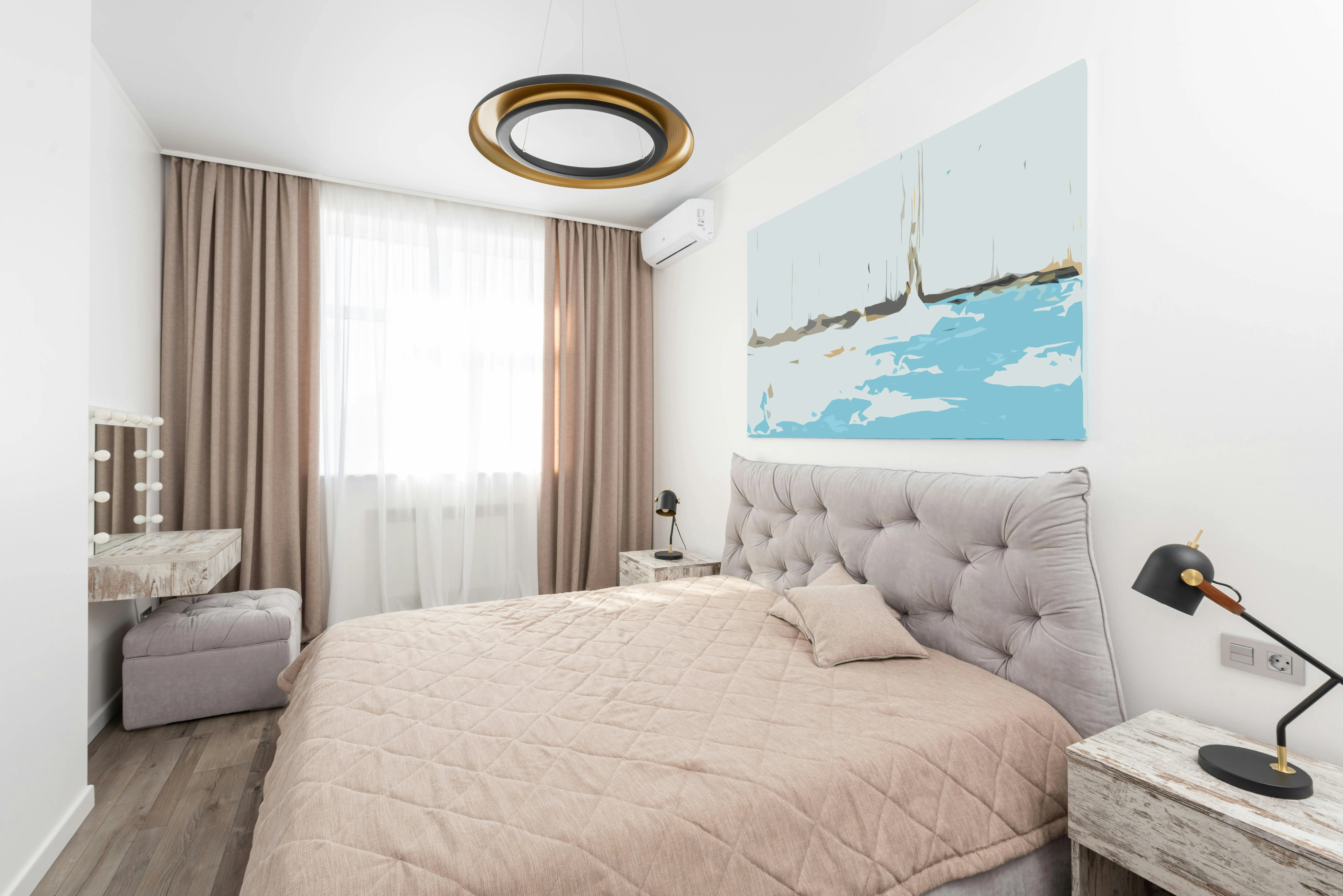 how much does a handyman charge to paint a room Modern bedroom interior with bed and bedside tables with lamps and pouf next to mirror and window with curtains