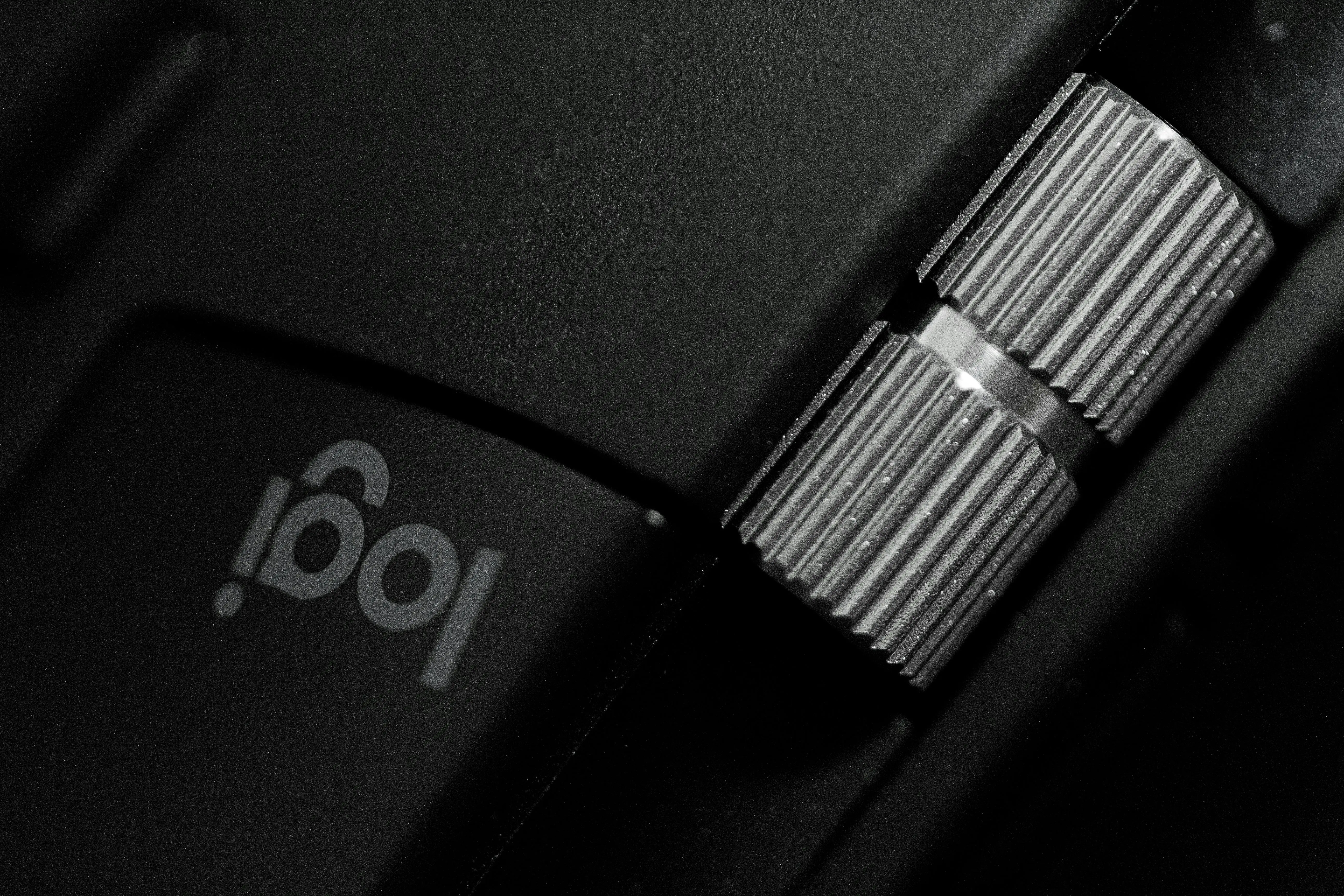 black cabinet knobs Close-up of a metallic adjustment knob on an electronic device, showing intricate detailing.