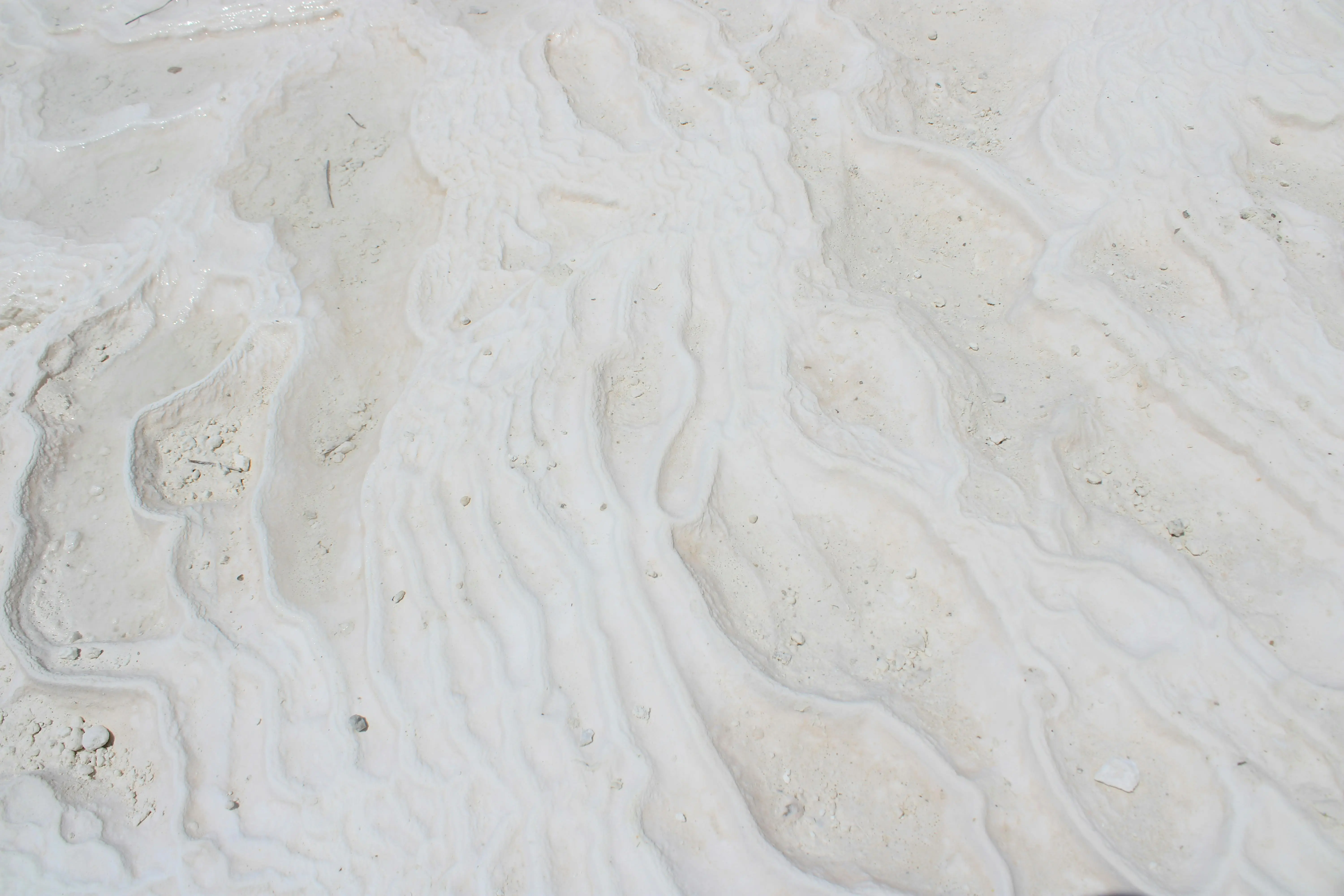 get rid of calcium deposit marks sink Close-up of Pamukkale's unique white travertine terraces in Denizli, Turkey.