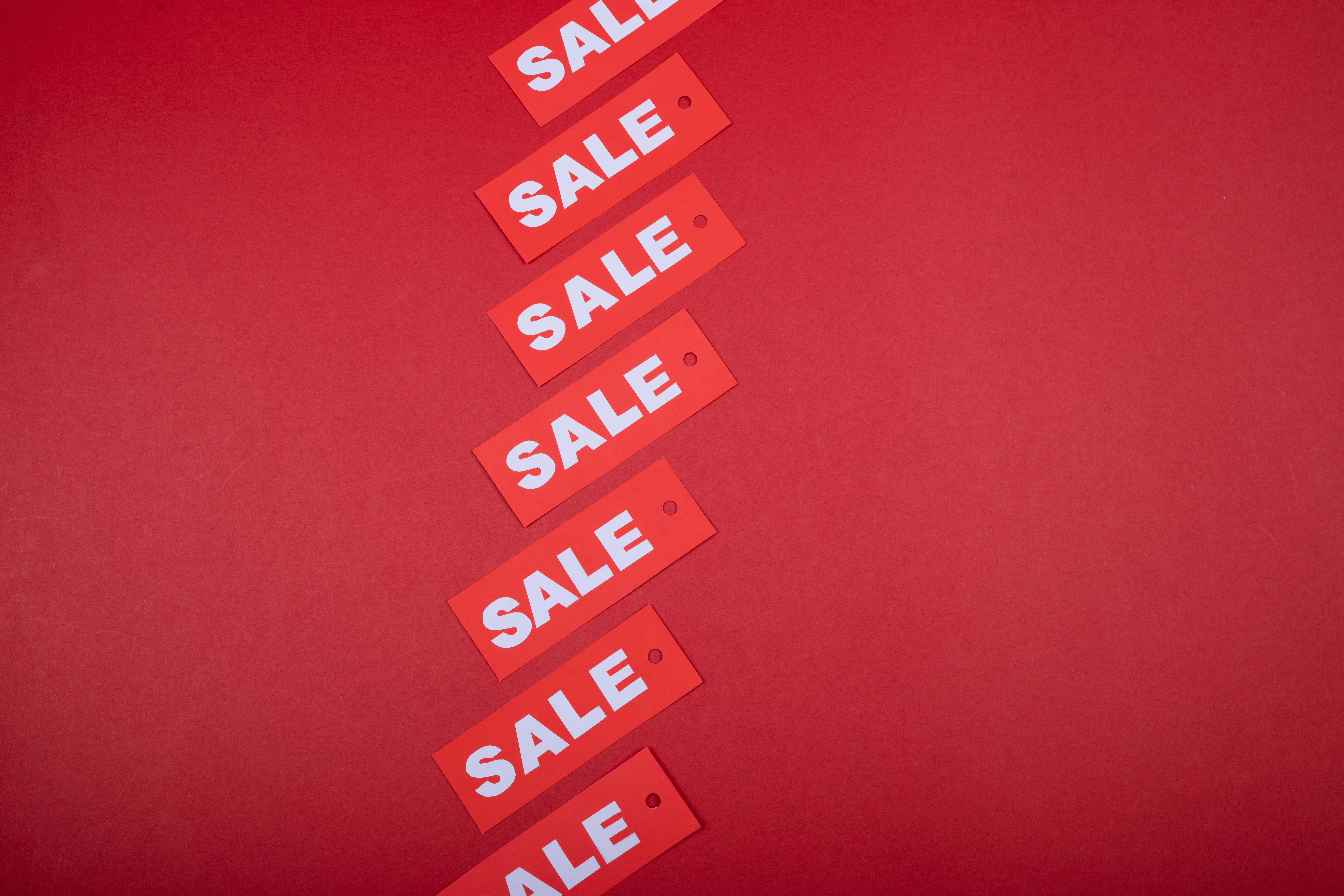 open box appliances Red sale tags aligned diagonally on a red background, perfect for retail promotions.