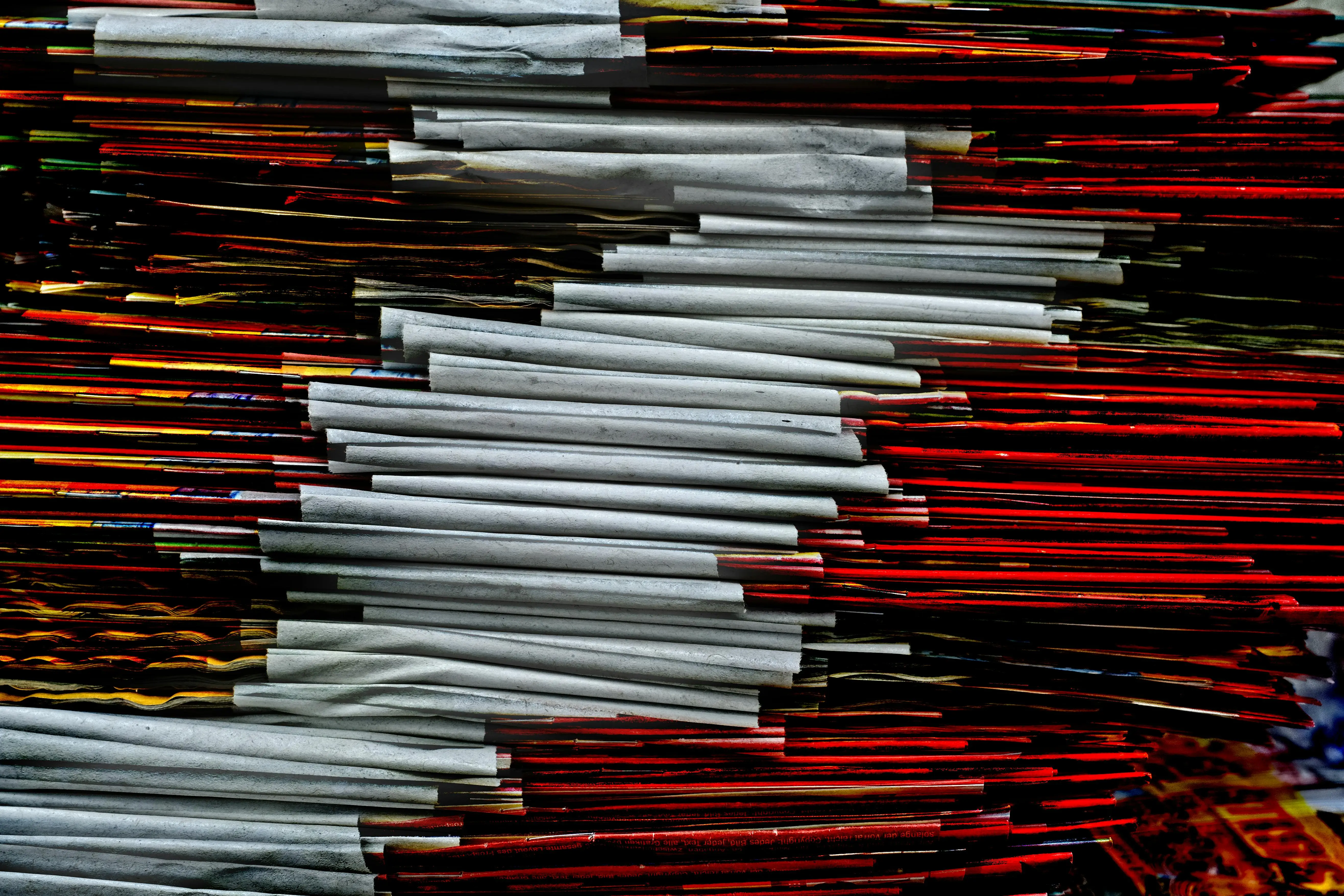 how to cut laminate flooring Stack of vibrant colored papers with a unique abstract arrangement photographed closely.
