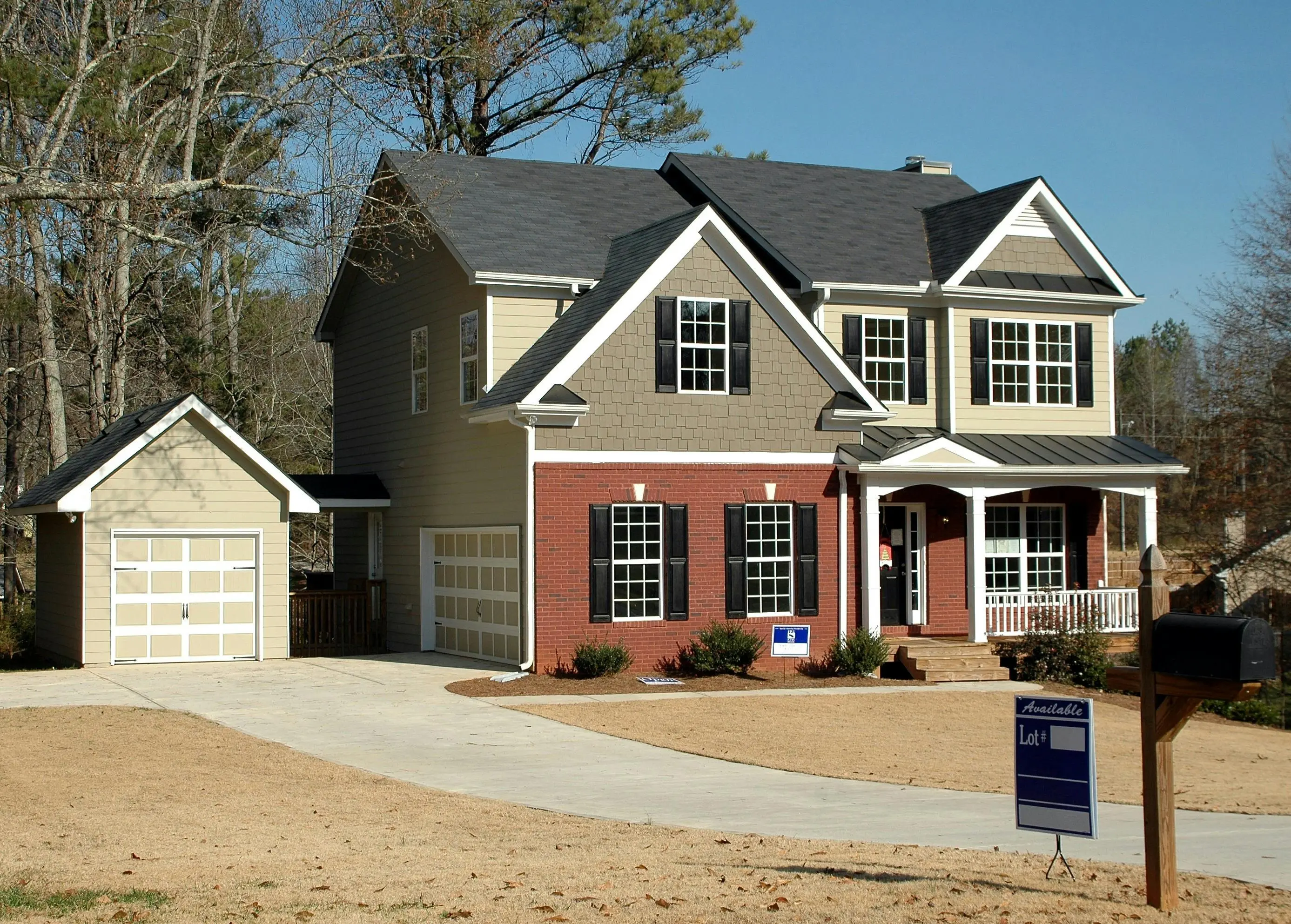 how much does it cost to side a house Beautiful two-story home with garage in a serene neighborhood, perfect for families.