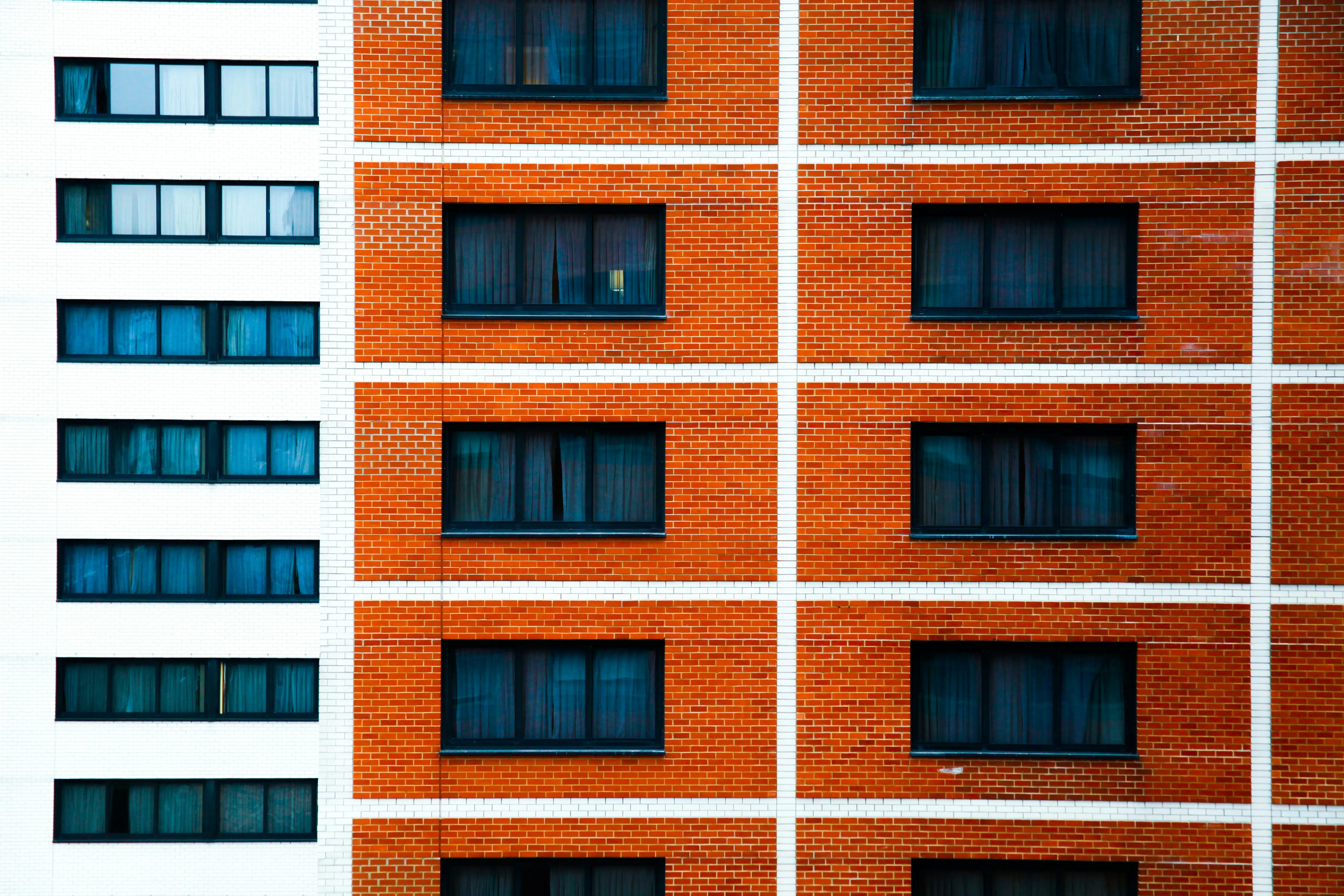 how do cockroaches get in your house Vibrant brick facade of an urban residential building in New York City.