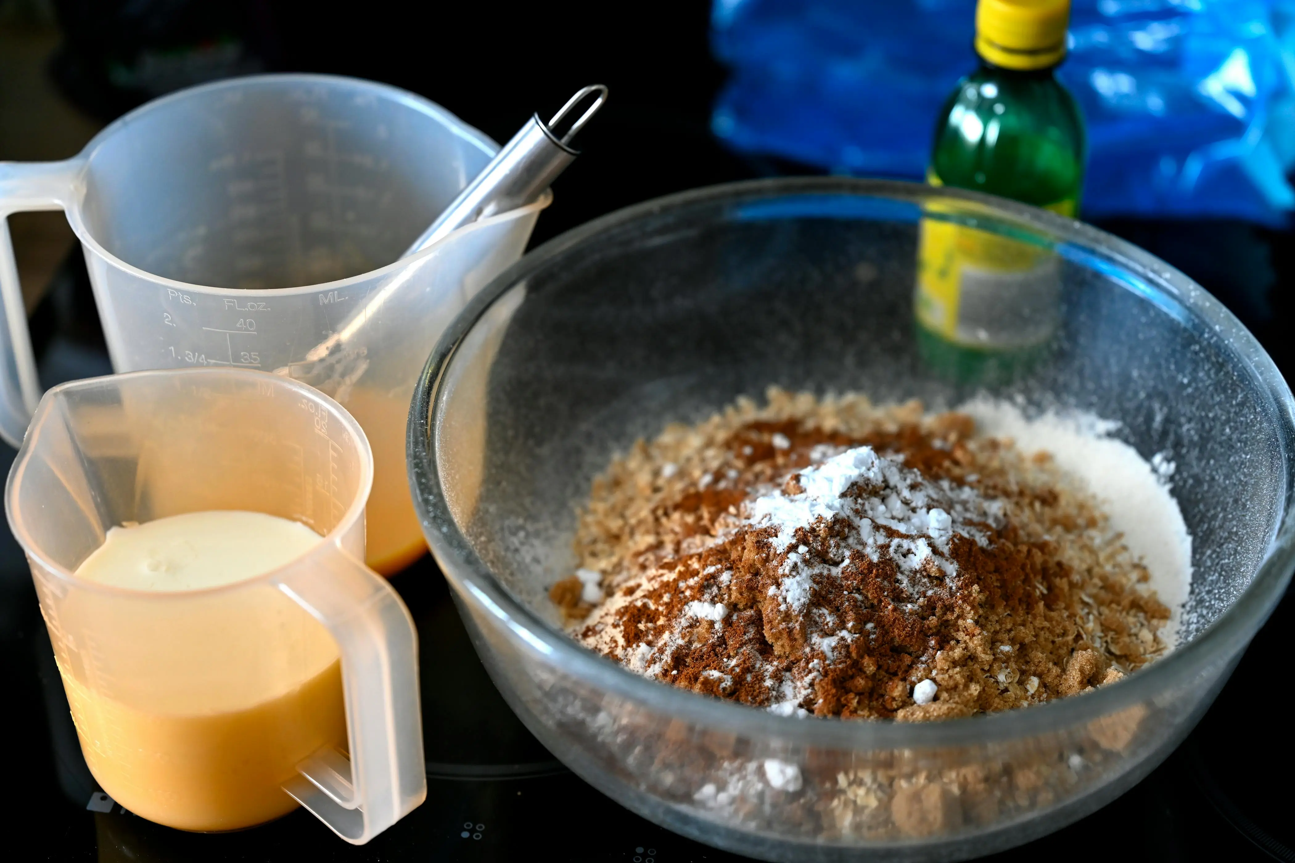 how to get rid of mildew smell in clothes A collection of baking ingredients ready for mixing in a glass bowl on the kitchen counter.