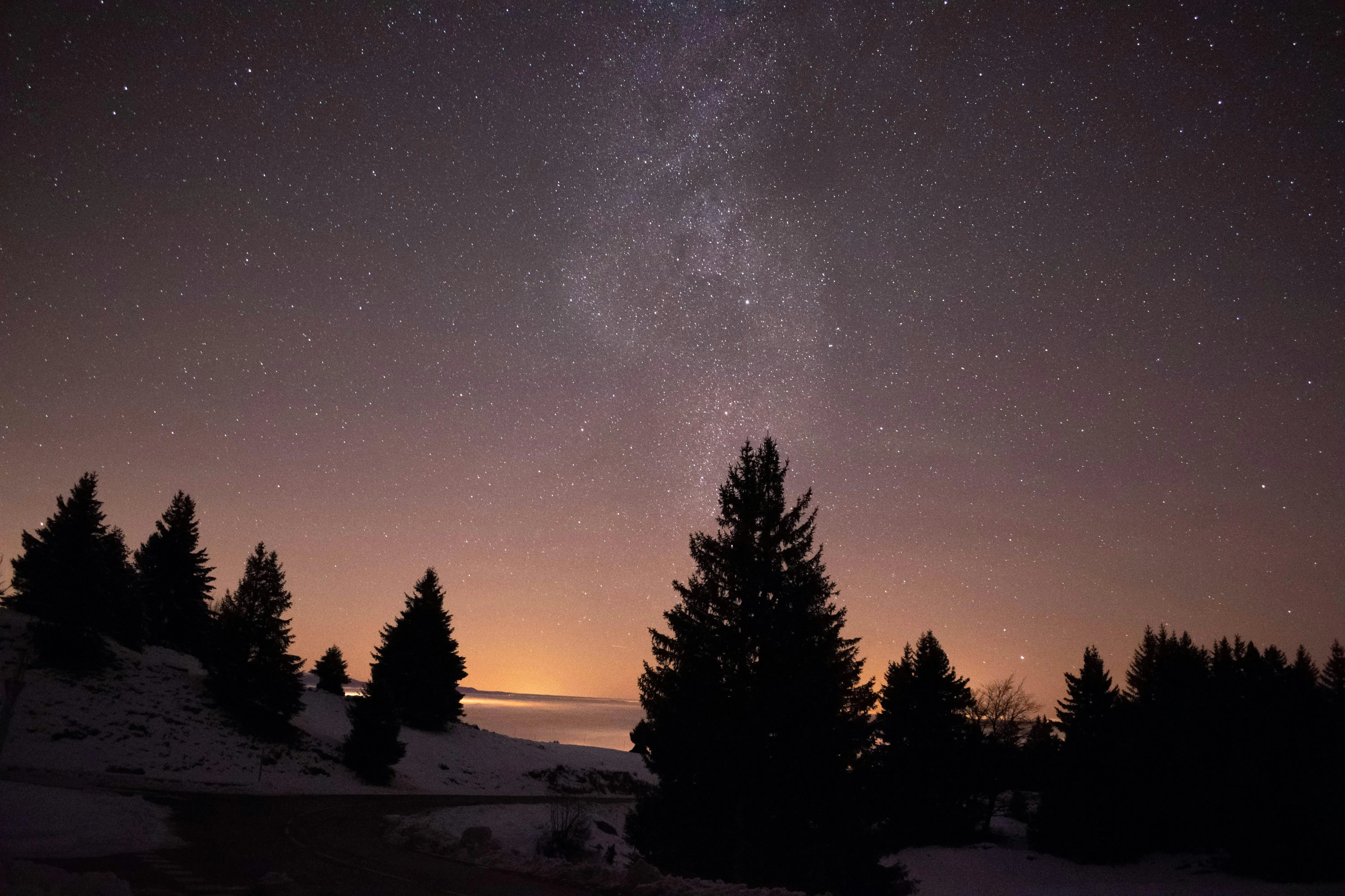 famous and easy paintings A serene starry night sky over snowy trees in Viuz-la-Chiésaz, capturing the Milky Way.