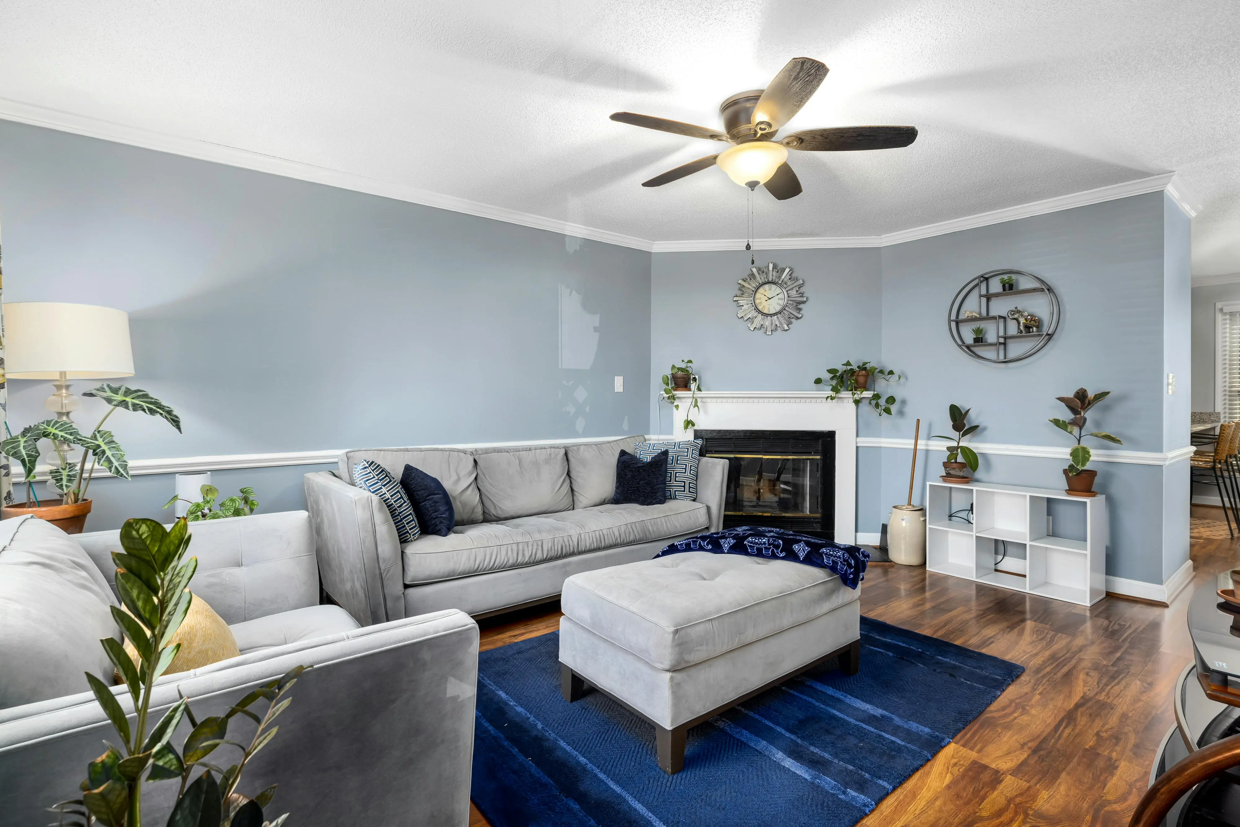 blue sectional sofa Stylish living room interior with blue decor and comfortable furniture.