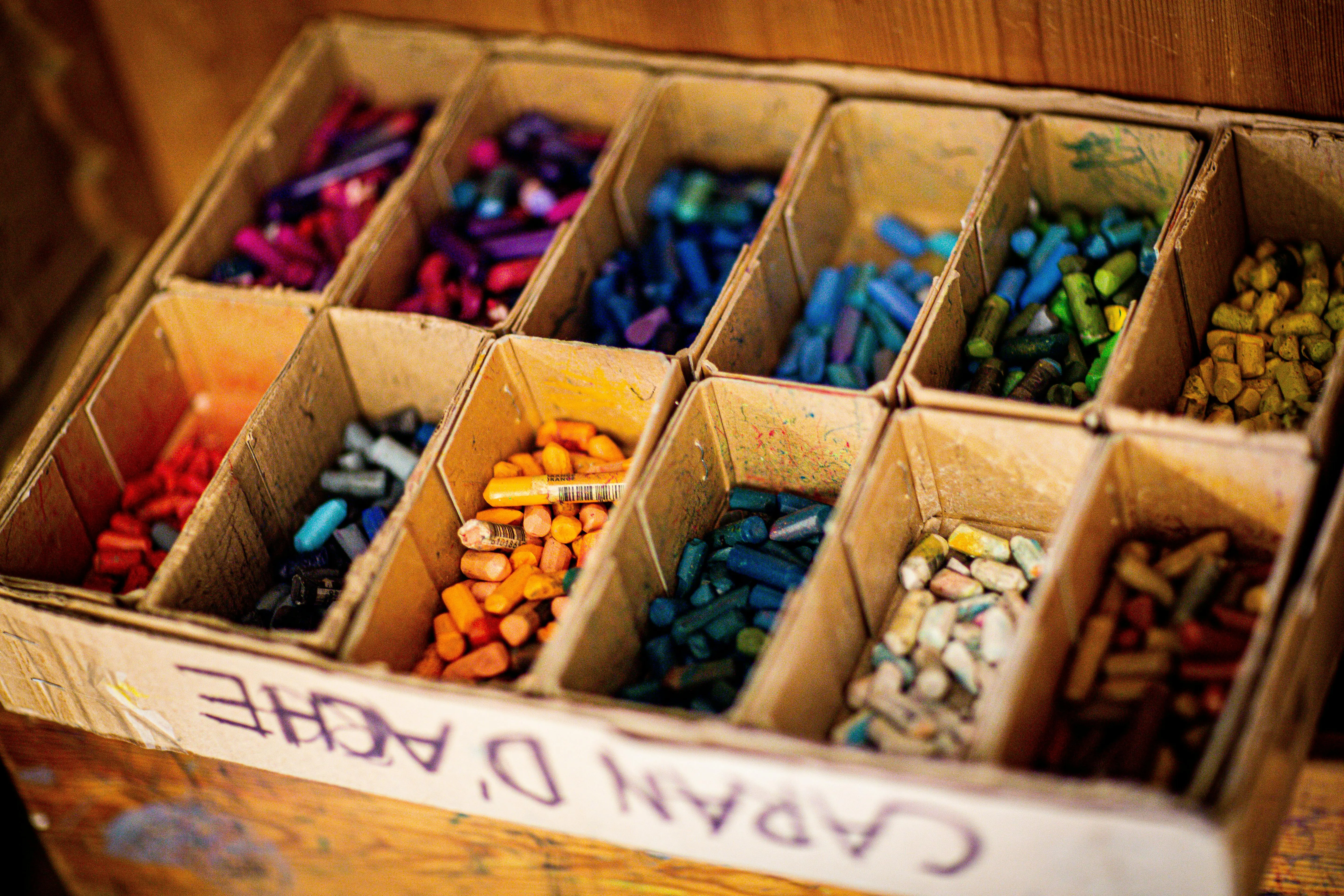painted furniture chalk paint A vibrant selection of crayons organized by color, perfect for art projects and creativity indoors.