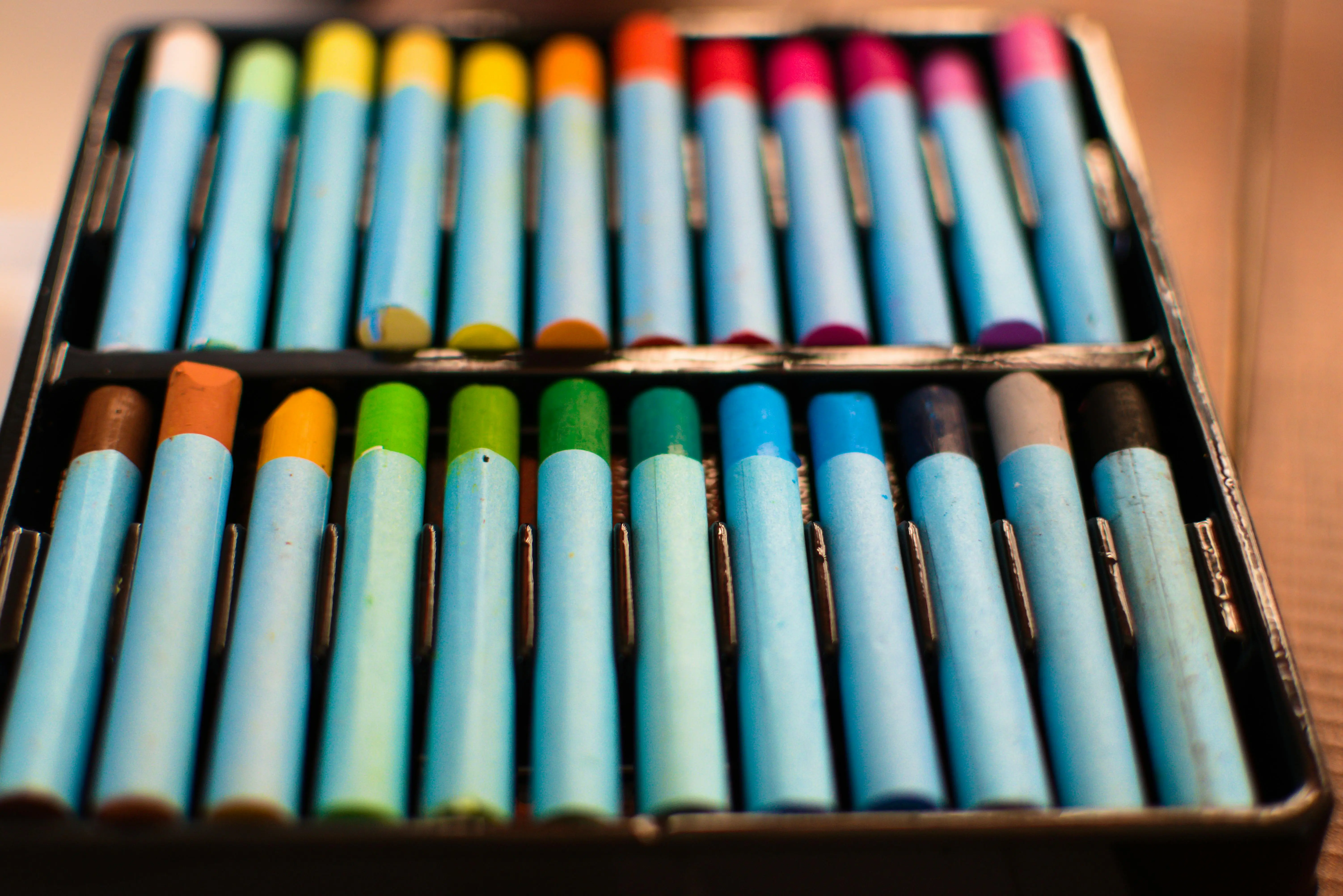 painted furniture chalk paint Colorful pastel chalks neatly arranged in a box, ideal for art and creative projects.
