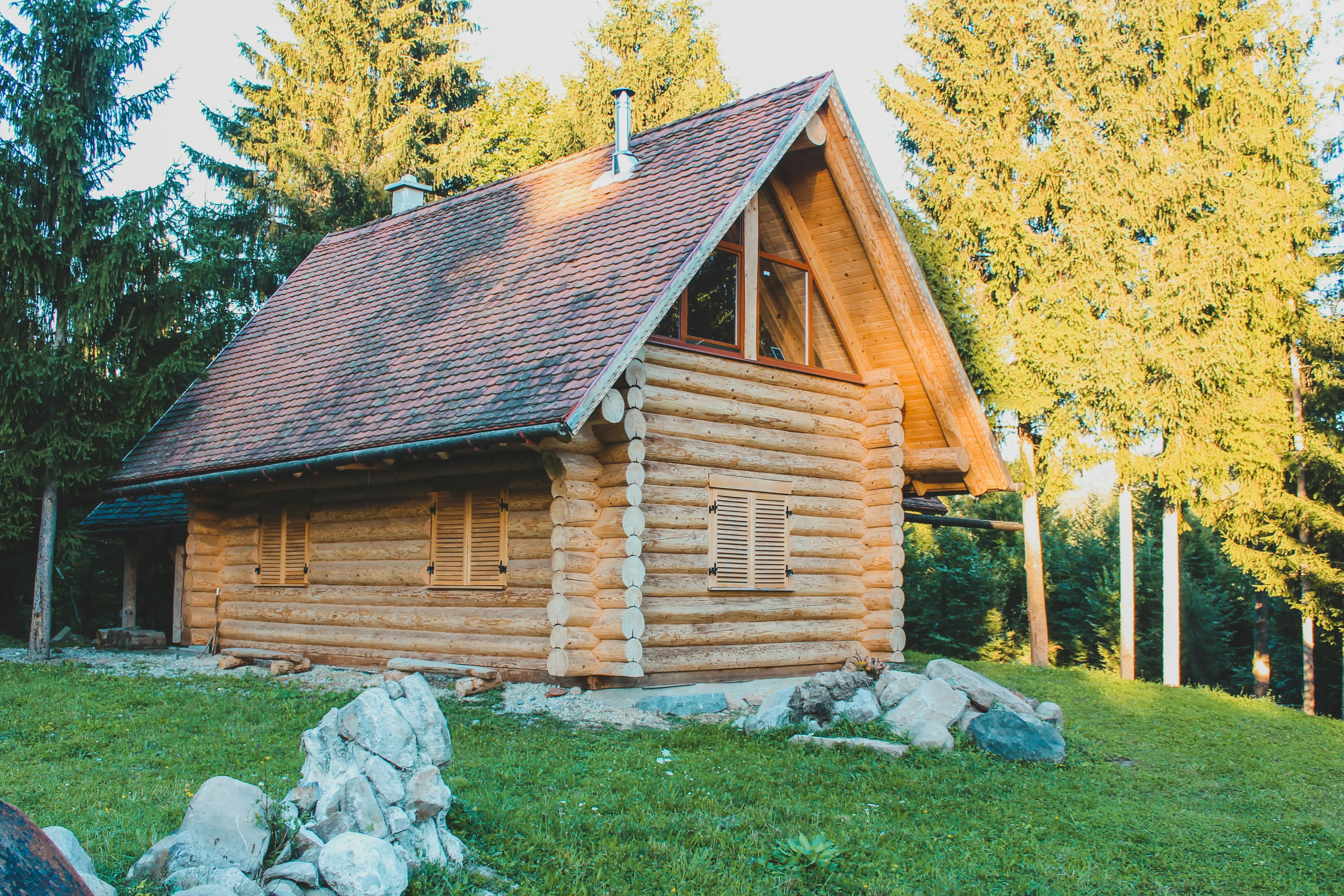 wood siding panels A charming wooden log cabin nestled amidst a serene forest landscape, capturing the tranquility of nature.