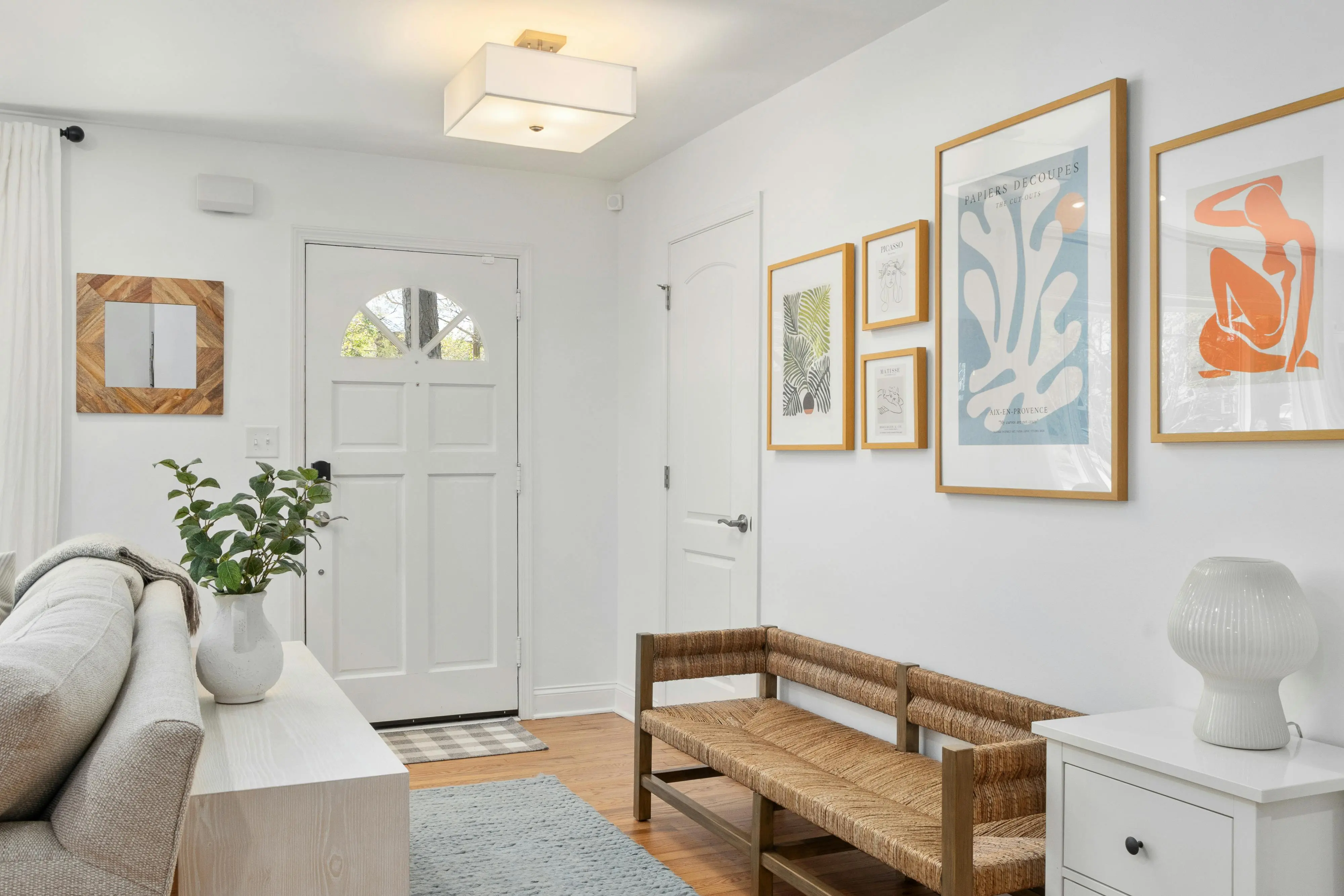 hallway art Bright Scandinavian style living room with modern decor, emphasizing minimalism and natural elements.