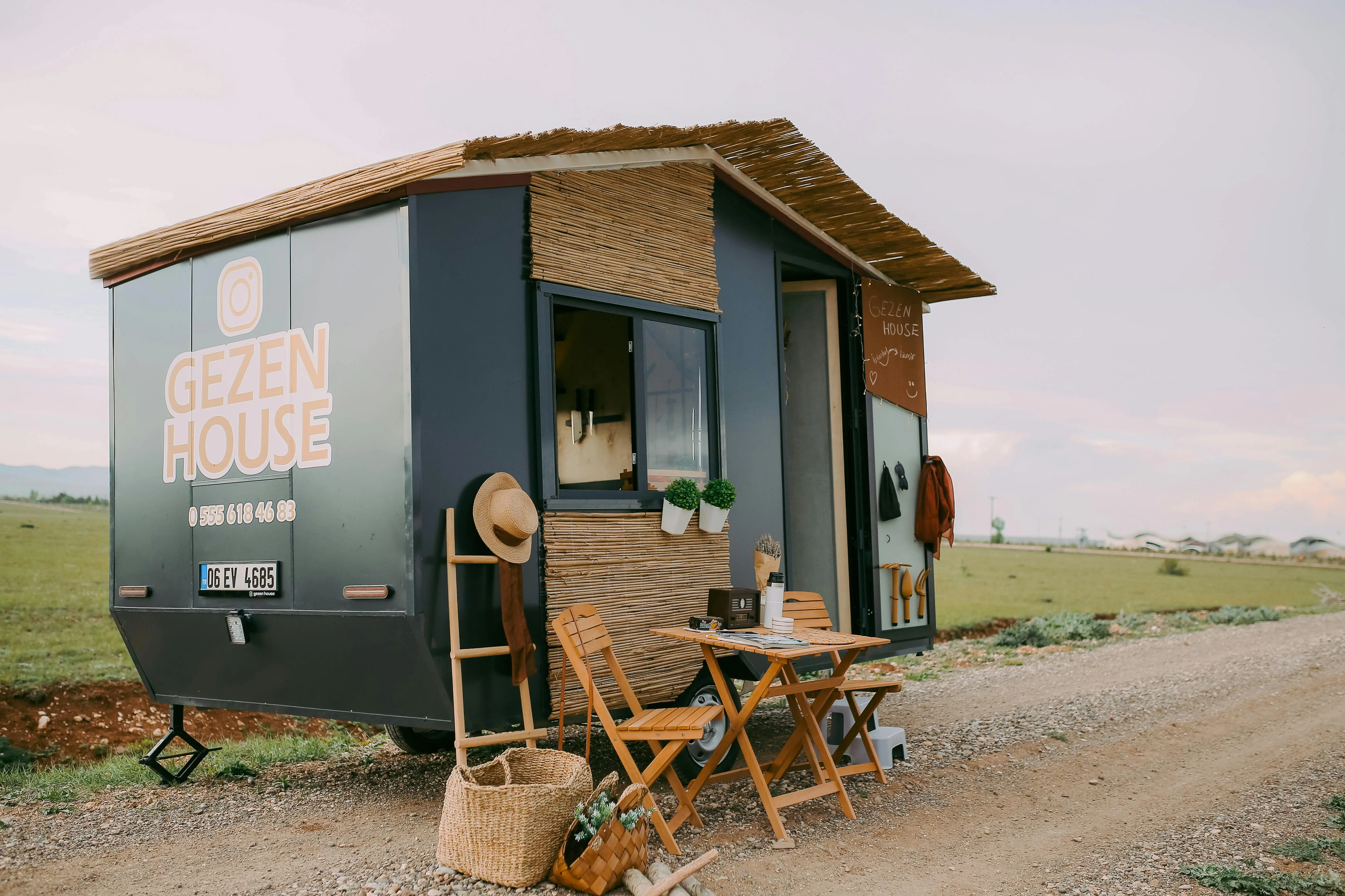 tiny house living tips A charming tiny mobile home set in nature, perfect for travel and adventure.