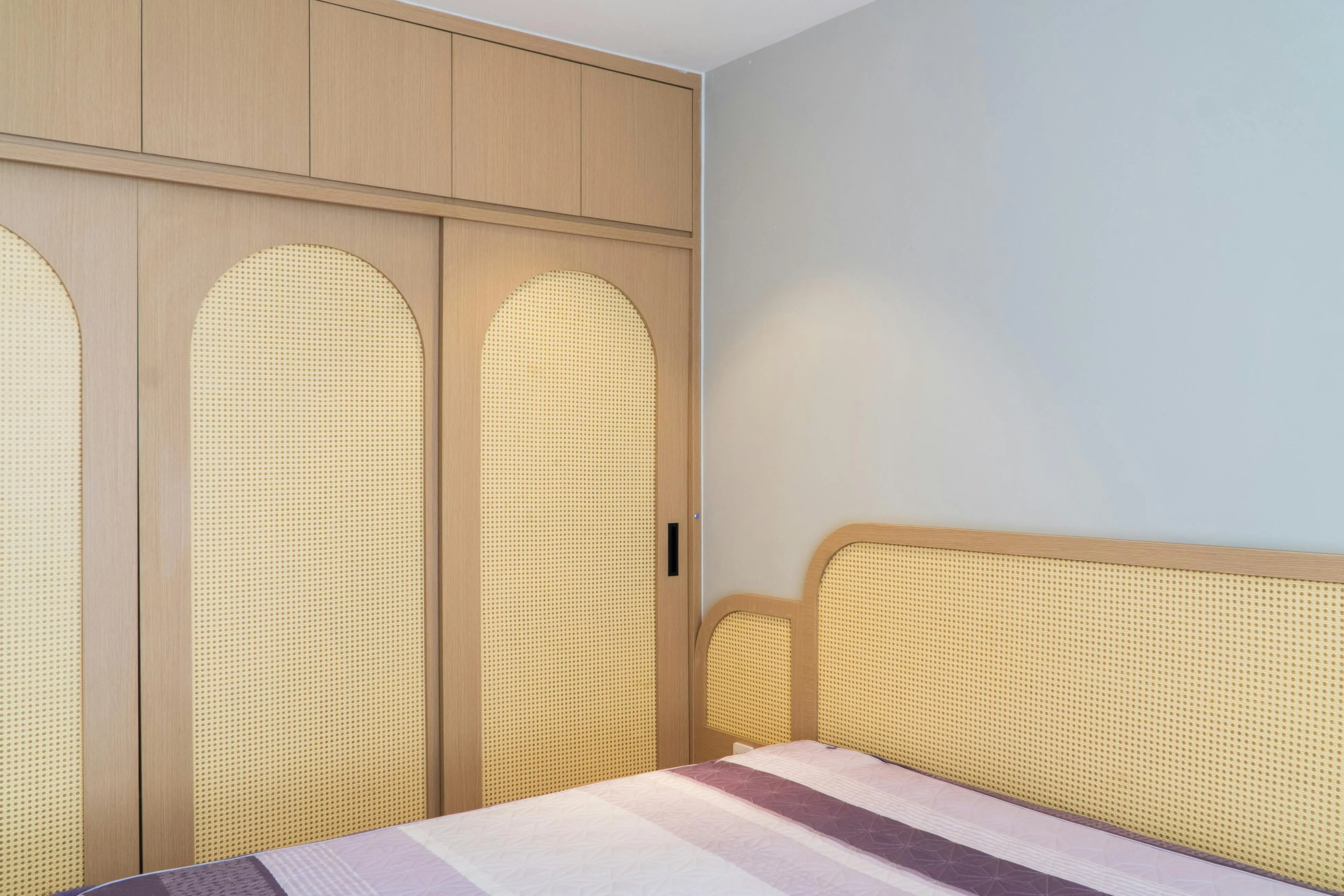 king platform bed with storage A stylish bedroom featuring a contemporary woven wardrobe and matching headboard design.