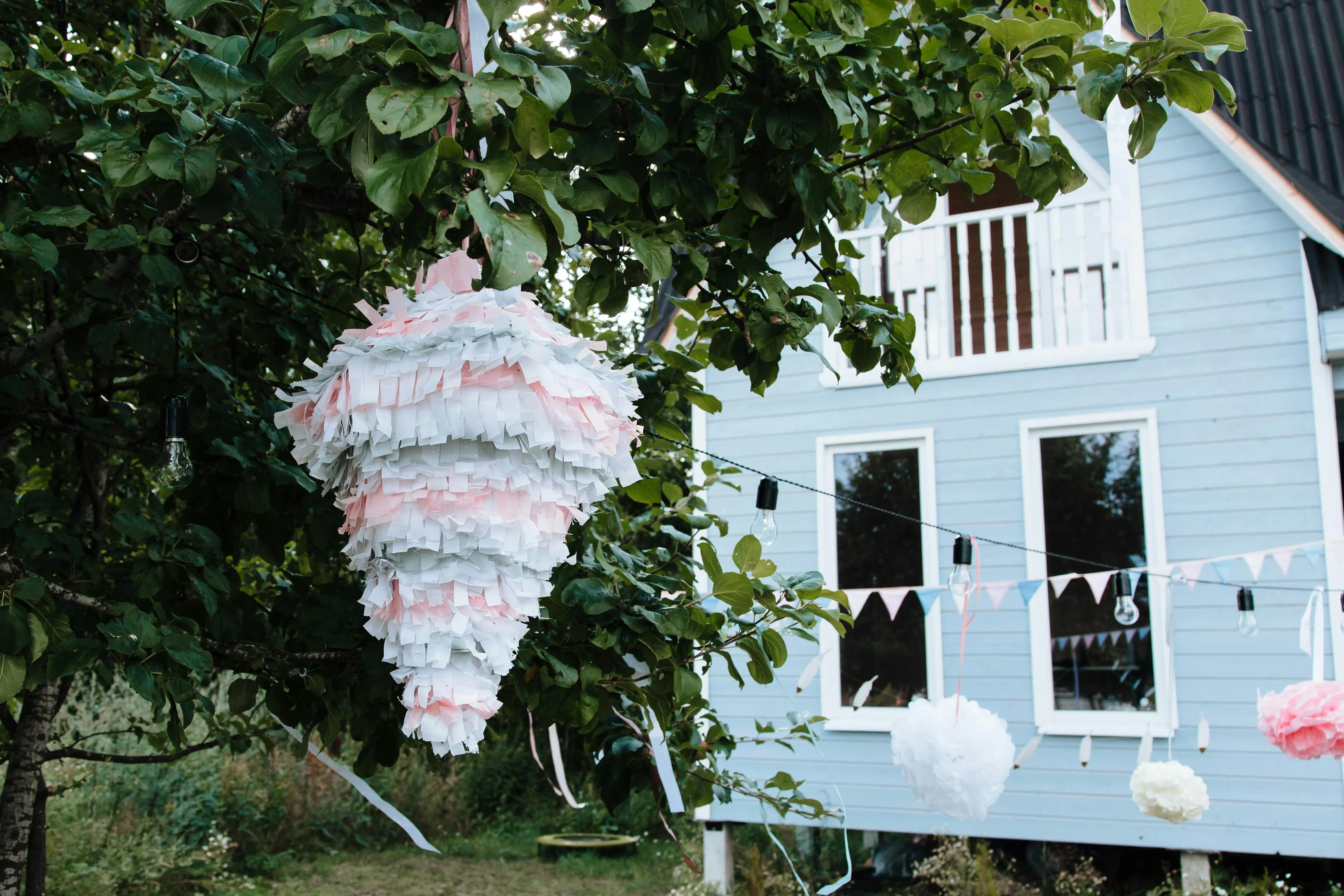 tiny house living tips A festive piñata and decorations in a vibrant garden setting, perfect for outdoor celebrations.