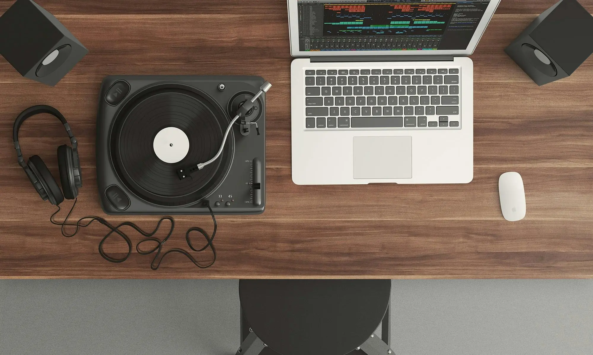 turntable and vinyl stand Top view of a music production desk with a laptop and turntable setup for modern audio production.