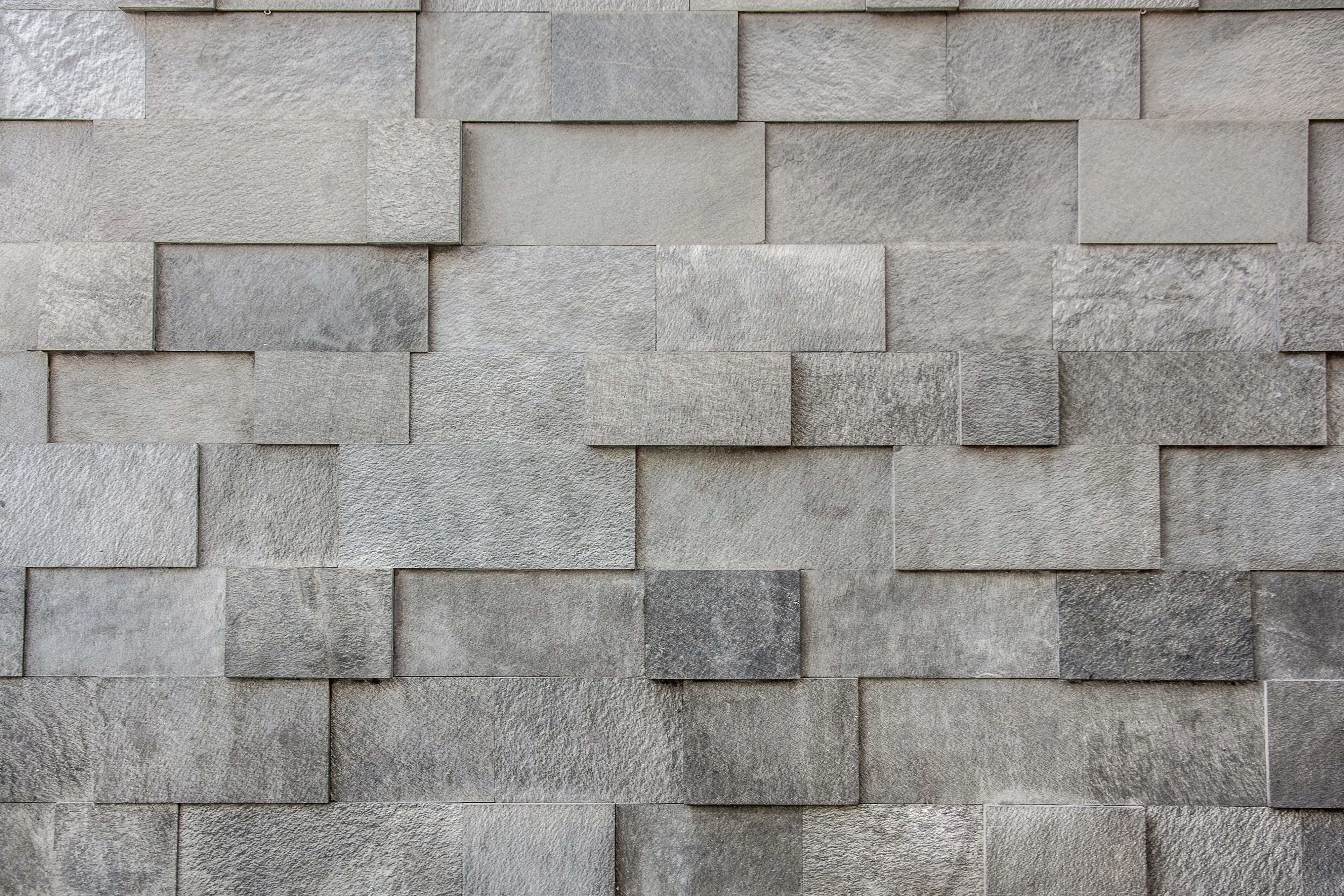 gray tile Close-up of a gray textured brick wall with seamless pattern.