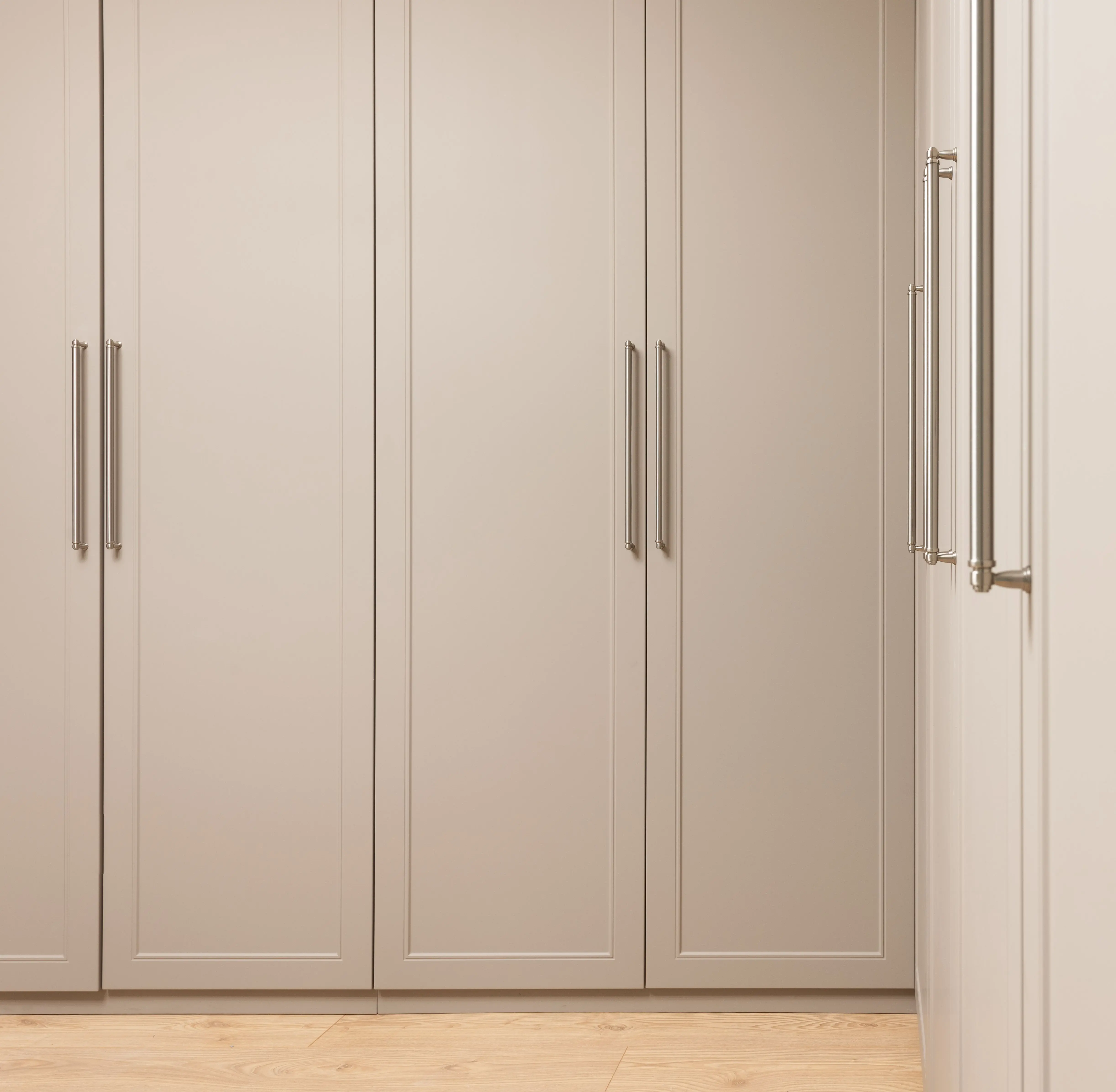modern kitchen cabinet handles Contemporary closet with beige doors and metal handles above floor in modern light house