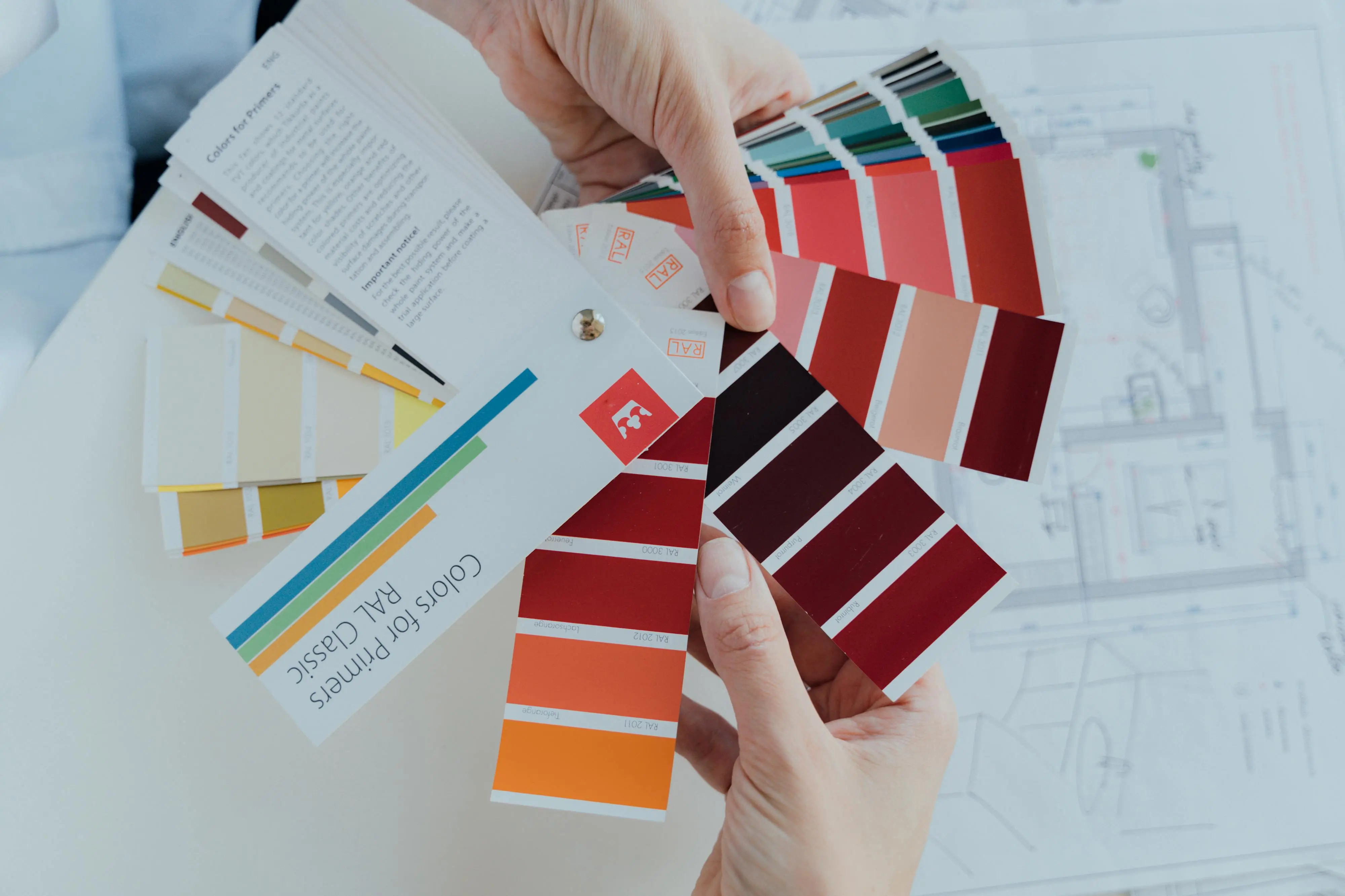 light green paint Person choosing color palettes for interior design projects, emphasizing creative choices.