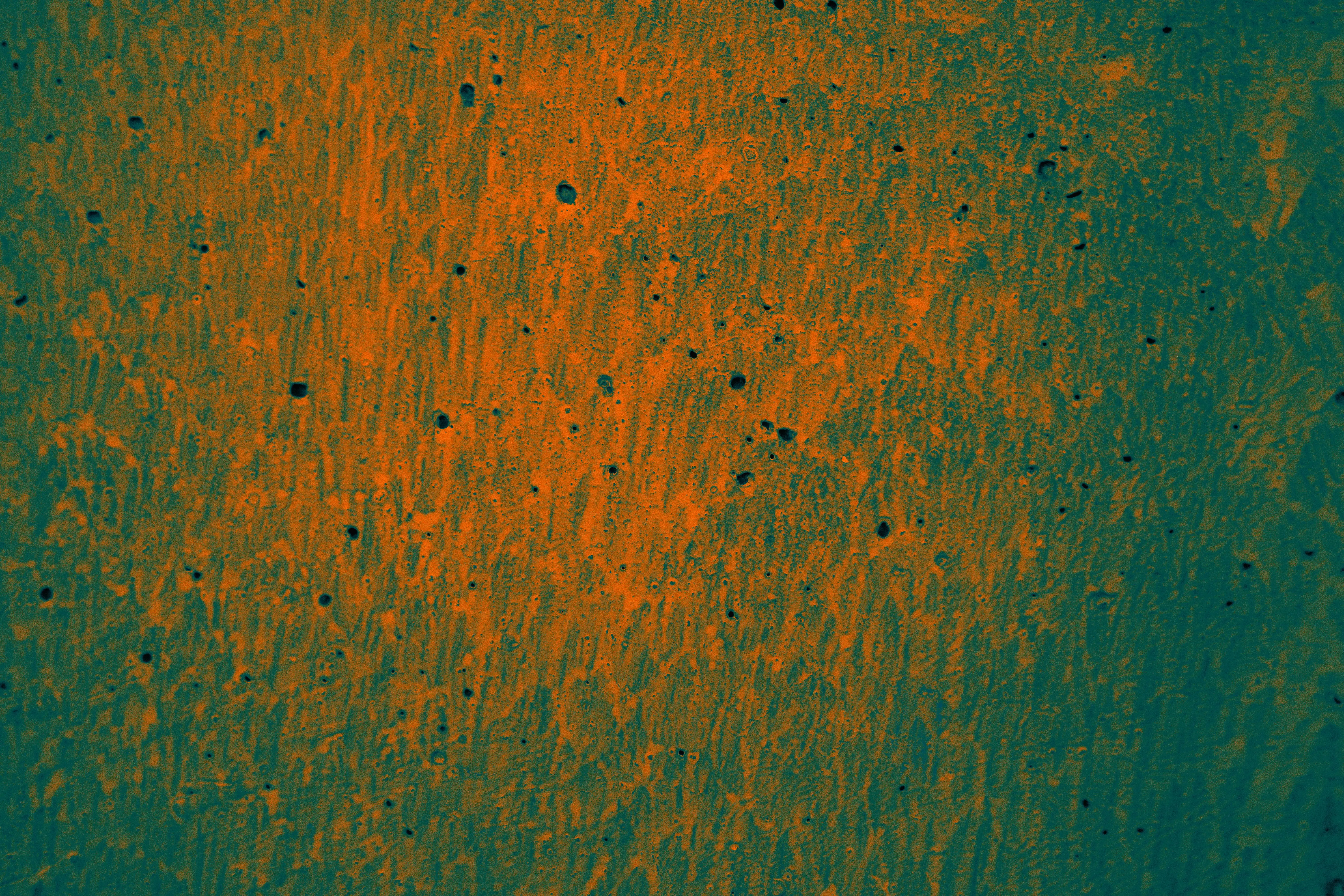 paint for cement floor An abstract orange texture with a pattern resembling a painted wall surface.