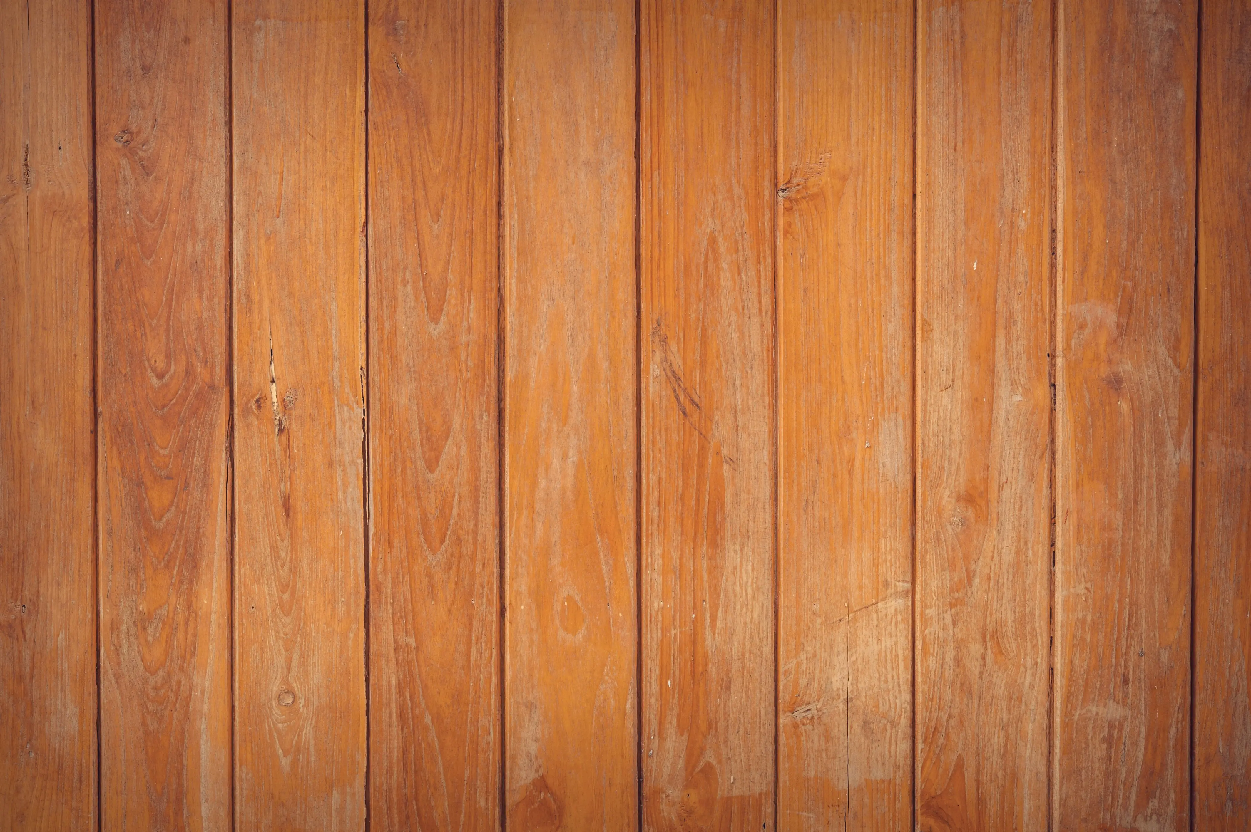 rustic wall decor Close-up of rustic wooden planks with a natural grain texture, ideal for backgrounds.